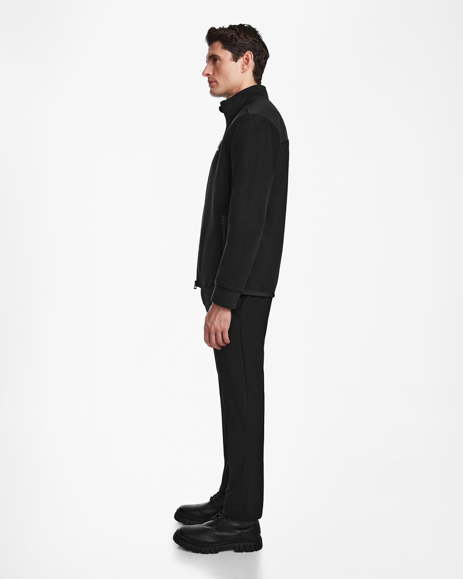 A man stands in profile against a white background, wearing Rudsak's CHILIWACK - M524500 Black/Black.