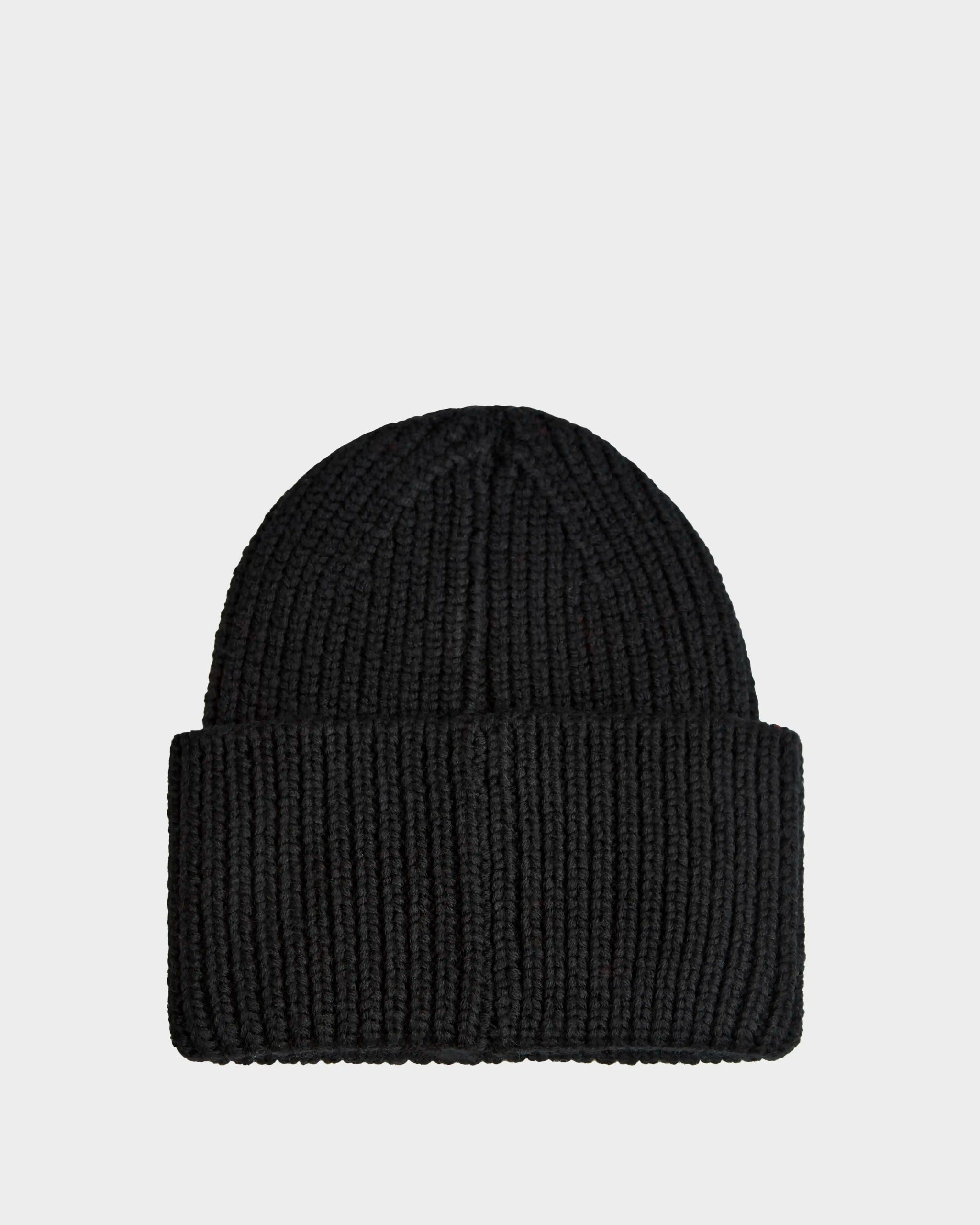The Rudsak COLIN - 9424518 Black beanie, crafted in soft knit with a folded brim, is shown against a white background. This unisex hat delivers timeless warmth and style for any season.