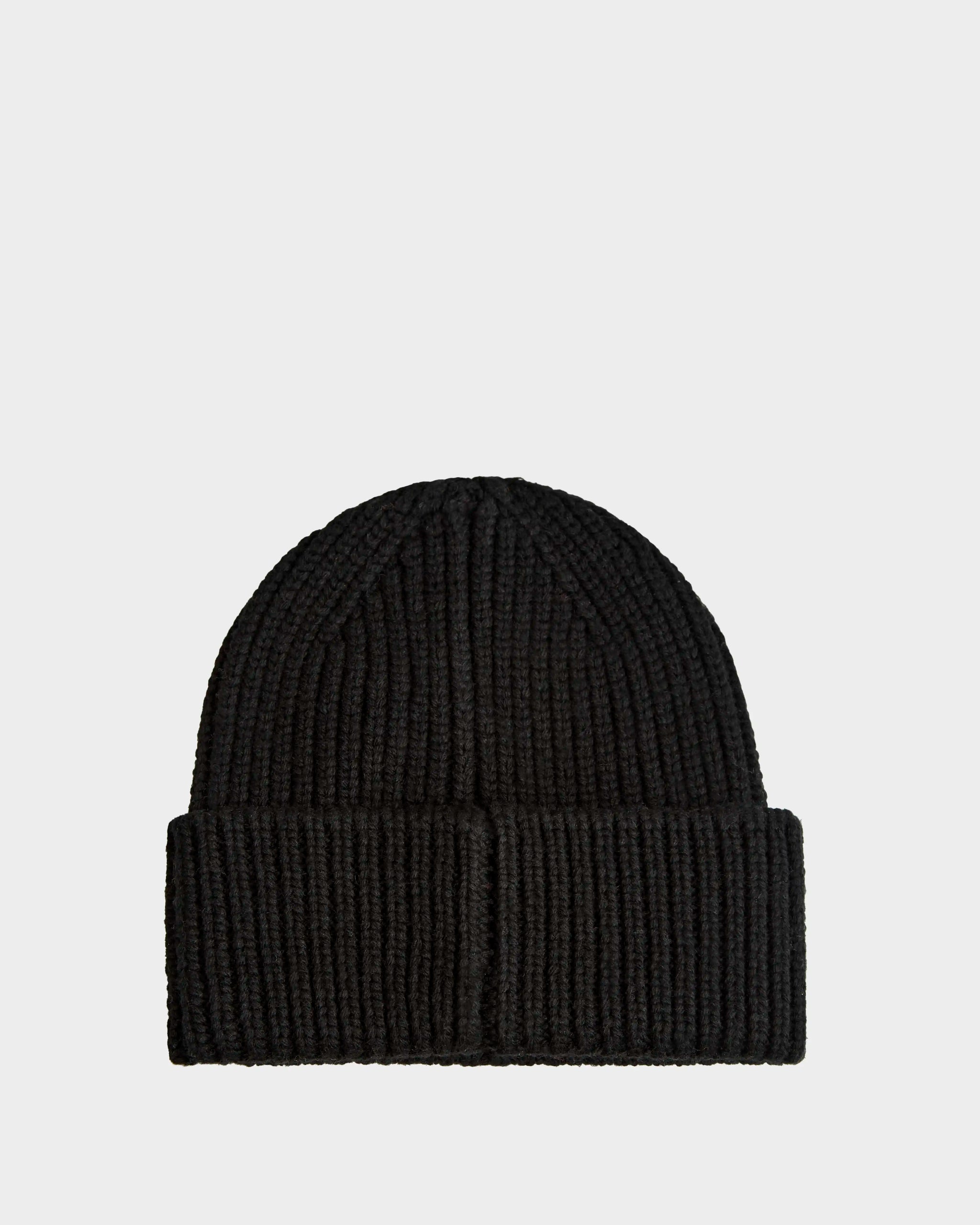 The CYBELLE - 9424504 Black by Rudsak is a unisex, black ribbed knit beanie with a folded brim, shown against a plain light gray background.