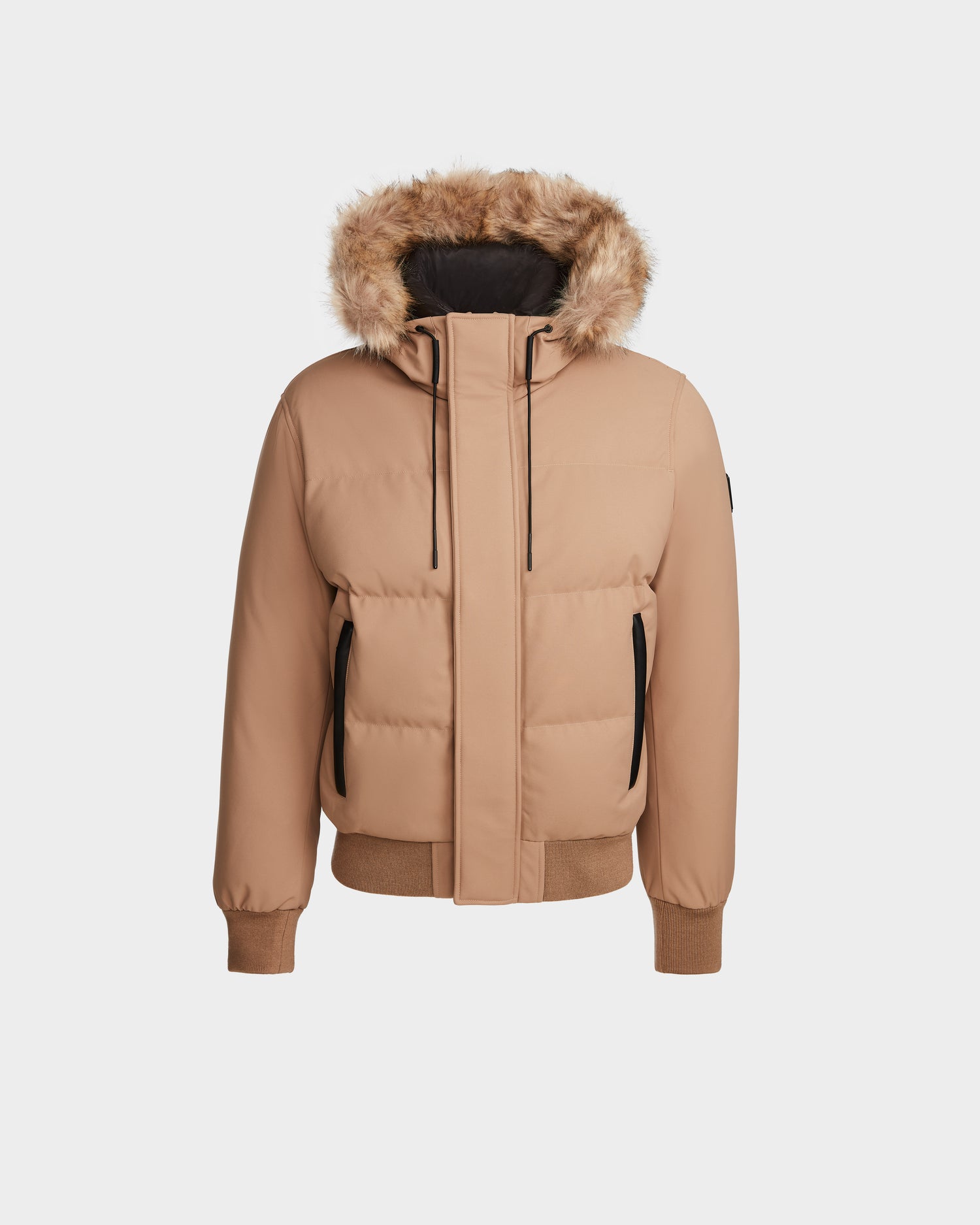 The DALLAS - M122501 Sand by Rudsak is a men's tan quilted puffer with a fur-trimmed hood, black zipper and pocket accents, ribbed cuffs and hem, and RDS-certified down—combining style and weather resistance for any occasion.