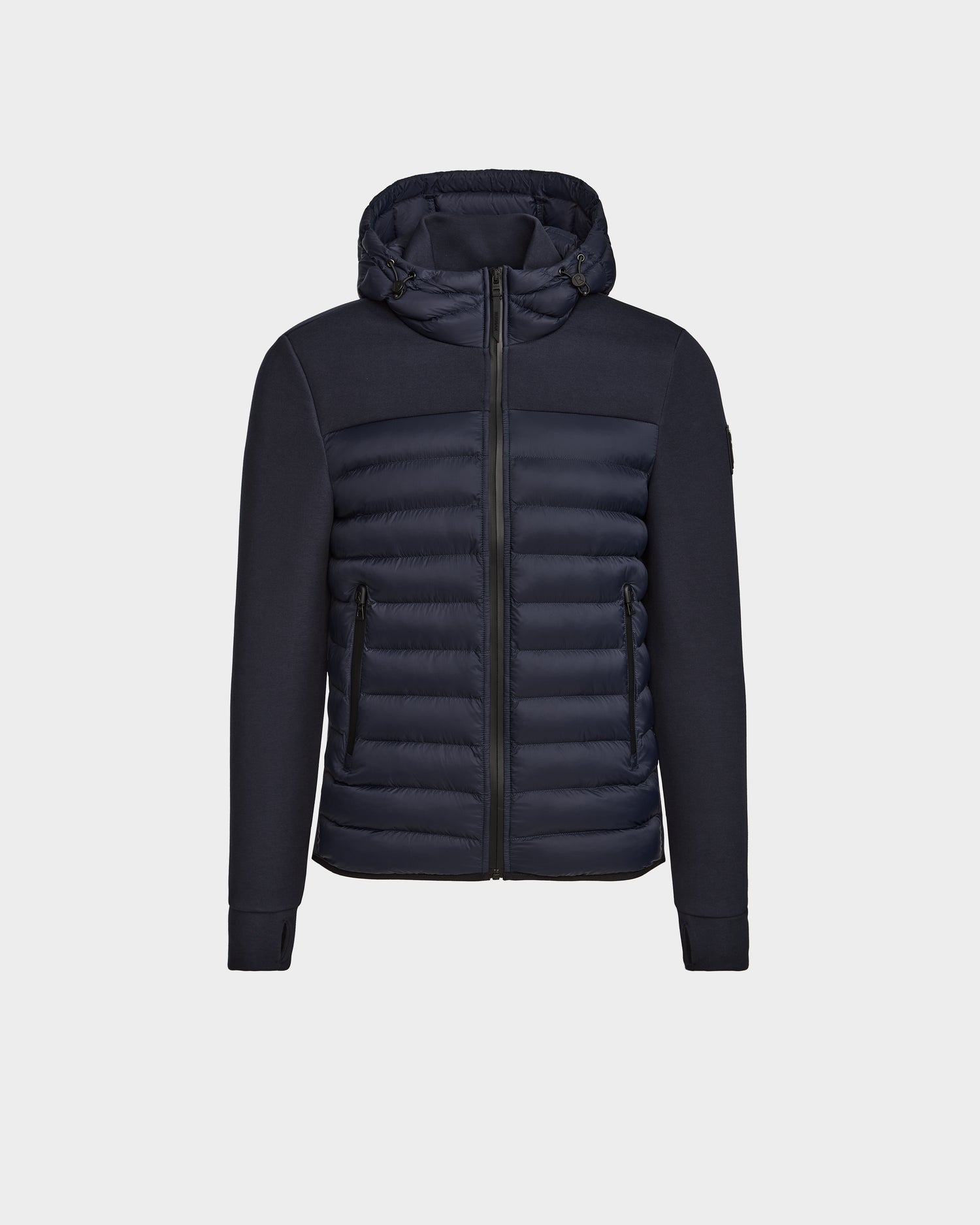 The Rudsak DURIN M - M123515 Navy men’s hooded jacket showcases a quilted front with lightweight down insulation, zippered pockets, and ribbed sleeves, all set against a plain light background.
