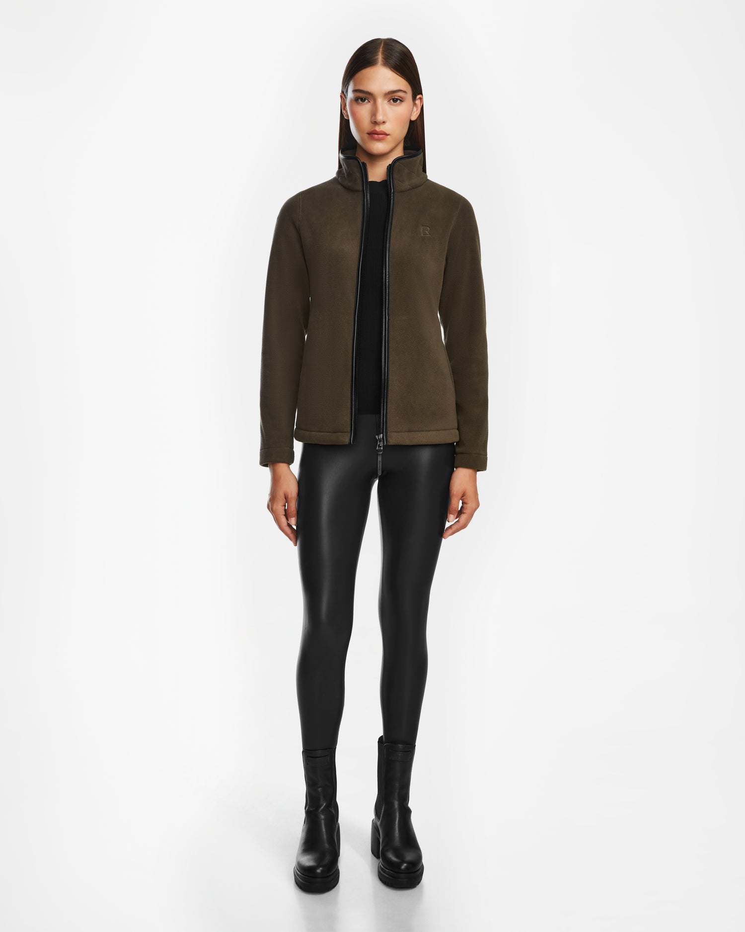 A woman wearing the EDITH - 8524617 Army sweater by Rudsak with brown vegan leather trim.