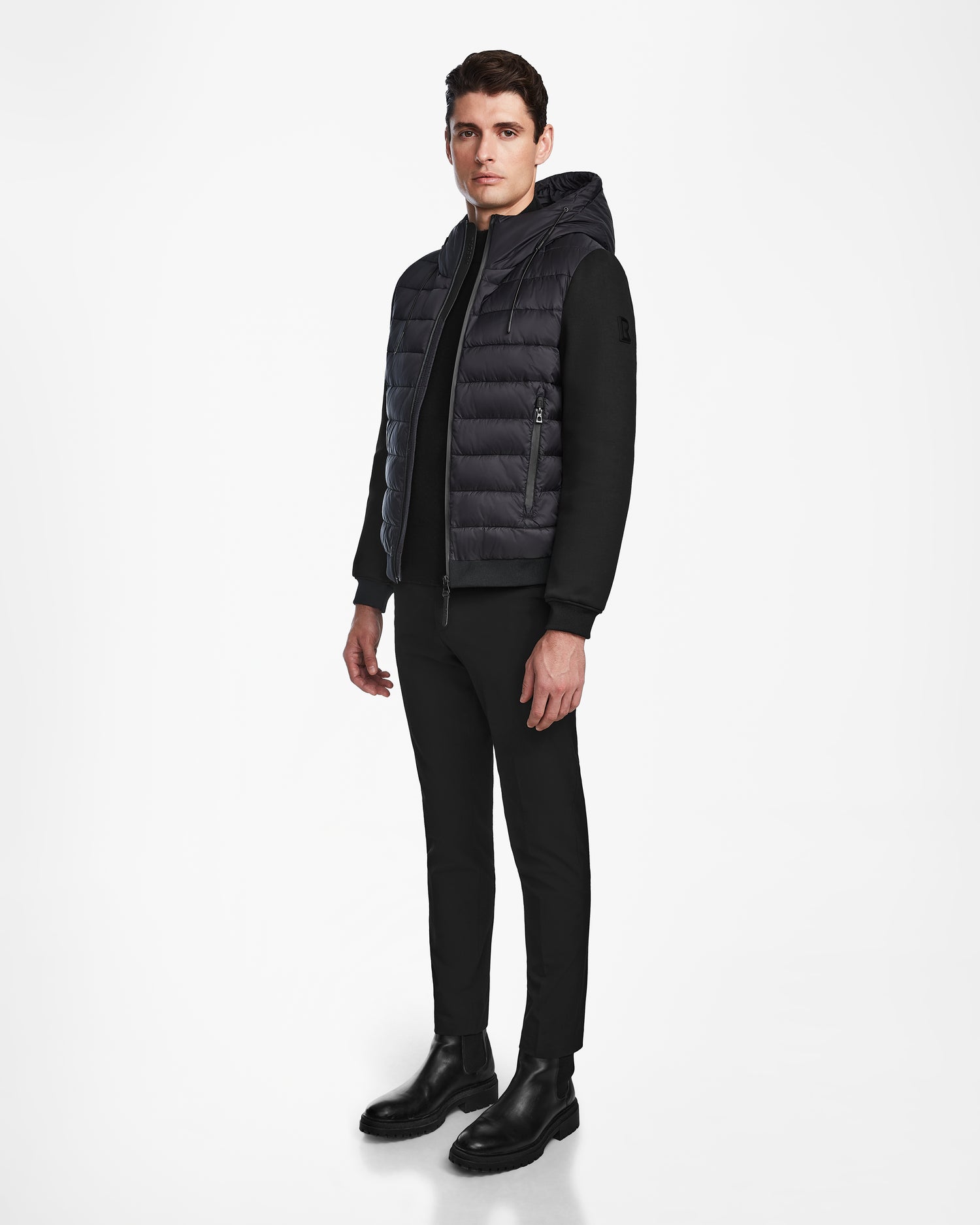 A man wearing the Rudsak ELIAS - M124002 Black men’s quilted light jacket.
