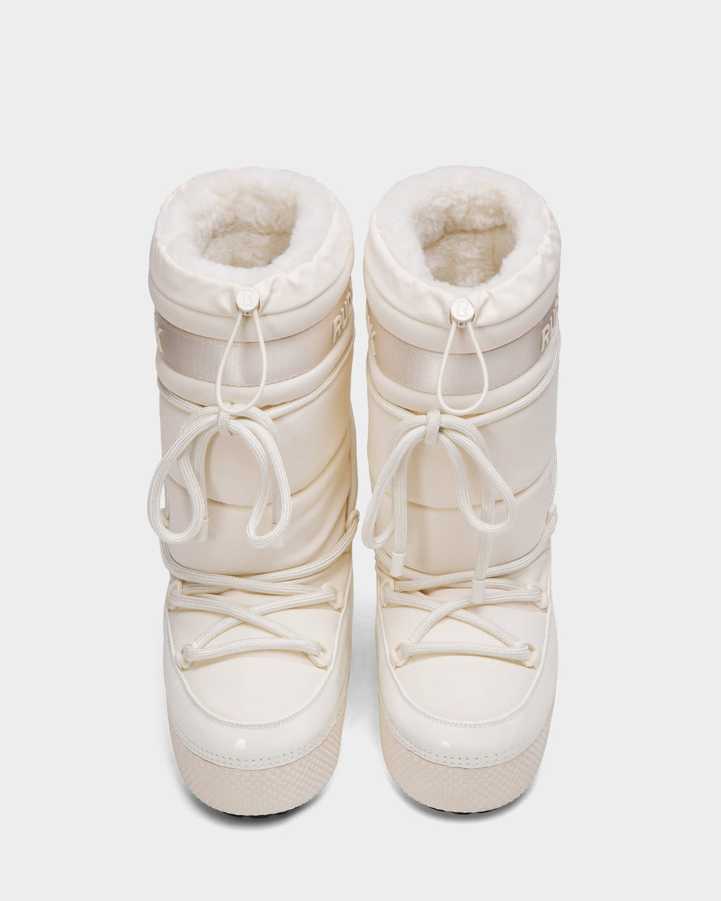 The Rudsak FARAH L - 8224542 Iceland women’s winter boots, cream-colored with white laces and faux fur lining, are water-repellent and insulated for comfort, shown from above on a plain white background.