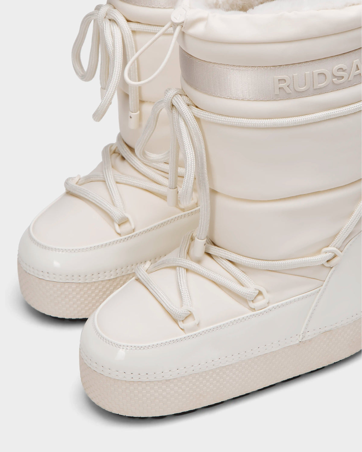 The FARAH L - 8224542 Iceland by Rudsak are white, water-repellent women’s winter boots—stylish and practical for cold weather.