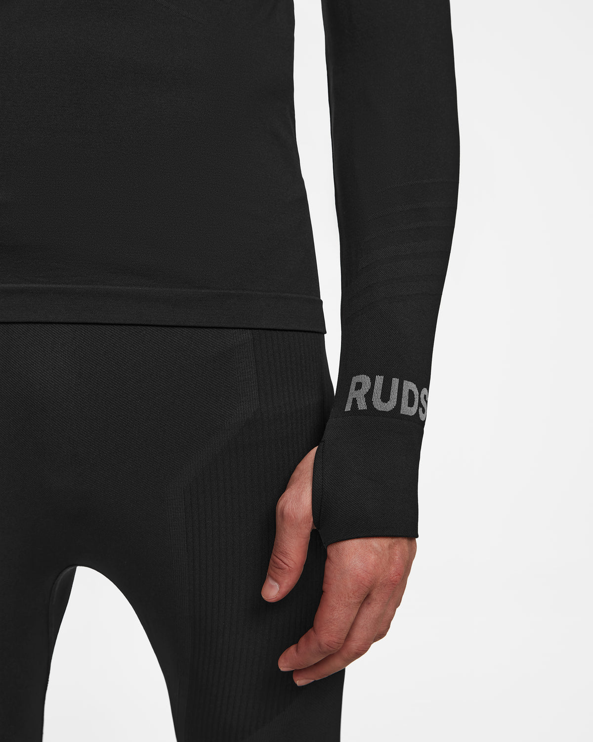 A person wearing the FRANC - 6524541 Black by Rudsak, a black fitted suit ideal as a men’s thermal set or ski underlayer, offering warmth and comfort.