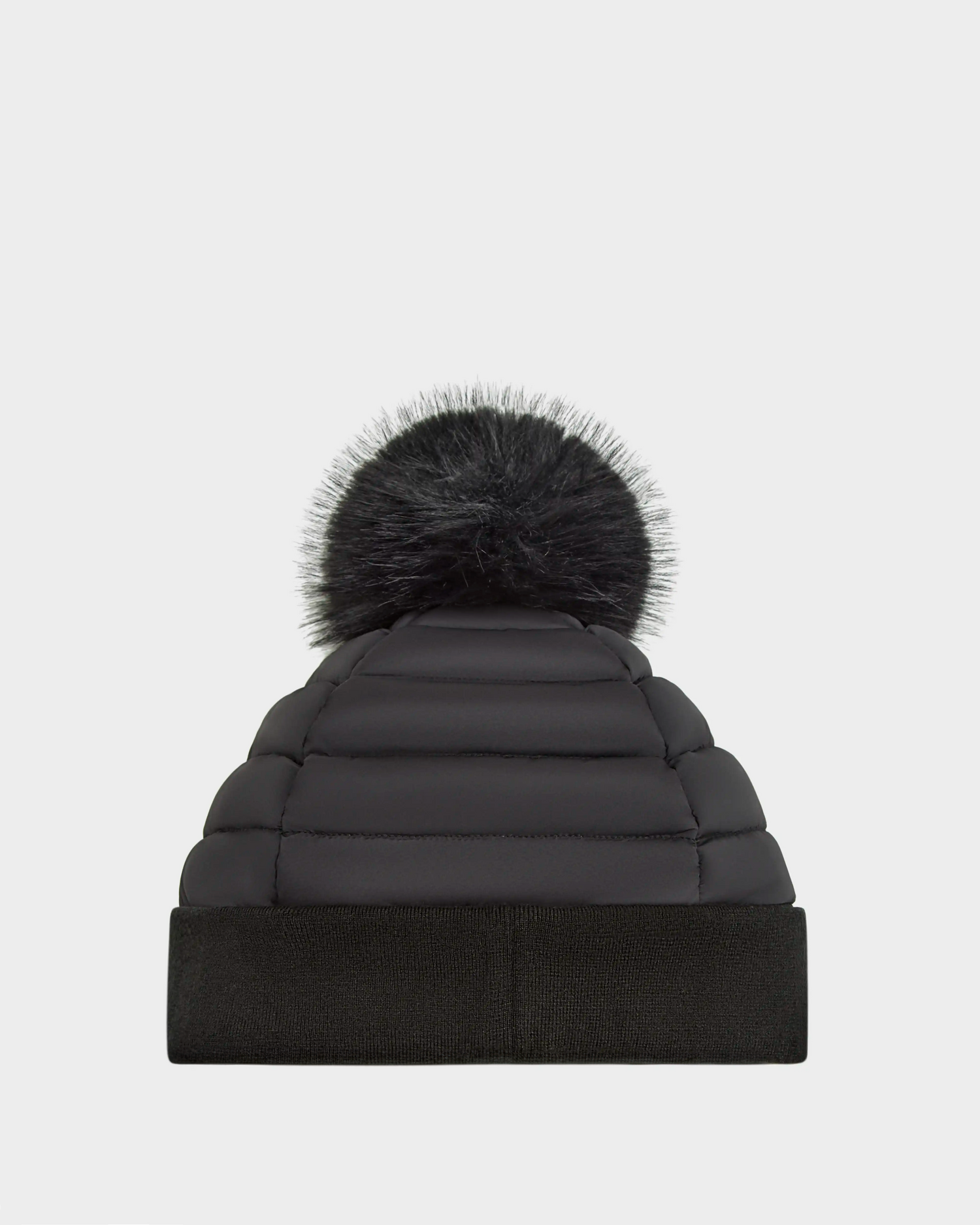The Rudsak GALA - 8424514 Black is a womens quilted down puffer hat with a wide folded brim and a fluffy faux fur pom pom, shown on a plain white background.
