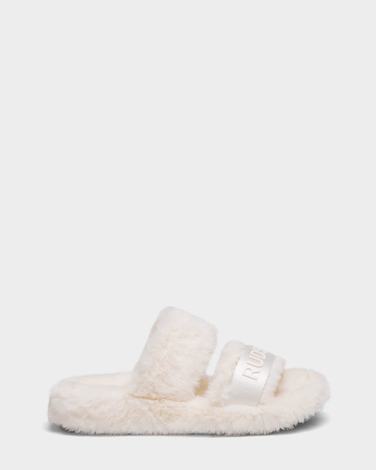 The Rudsak GEMA - 8223510 Iceland is a women’s cream faux fur slipper slide with two wide straps, one featuring subtle text. This open-toe design offers a plush, soft texture for cozy comfort.