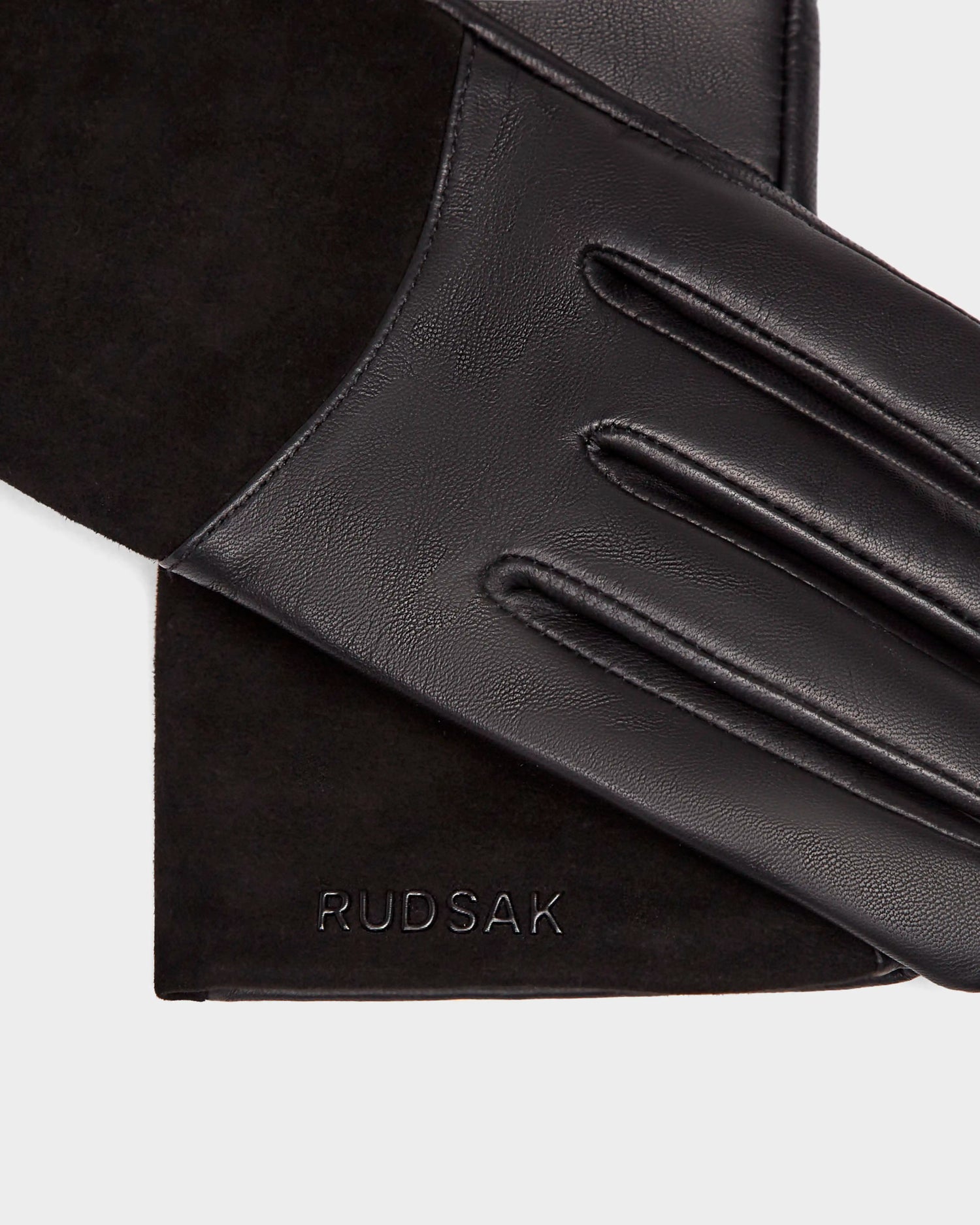 HELENA - 8424529 Black gloves by Rudsak, lined with black wool, rest on matching black suede, both embossed with the Rudsak brand name.