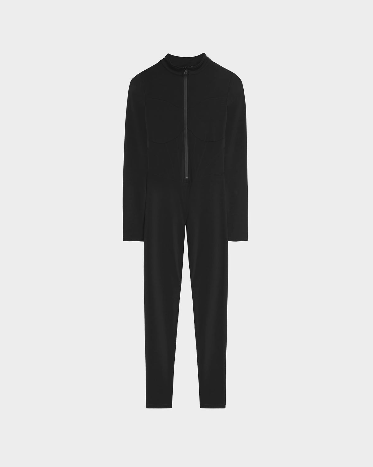 The Rudsak IVY - 8524599 Black is a black, long-sleeve, full-length zip-up bodysuit with two chest pockets and a front zipper, perfect for ski-chic style. Shown against a plain light gray background.
