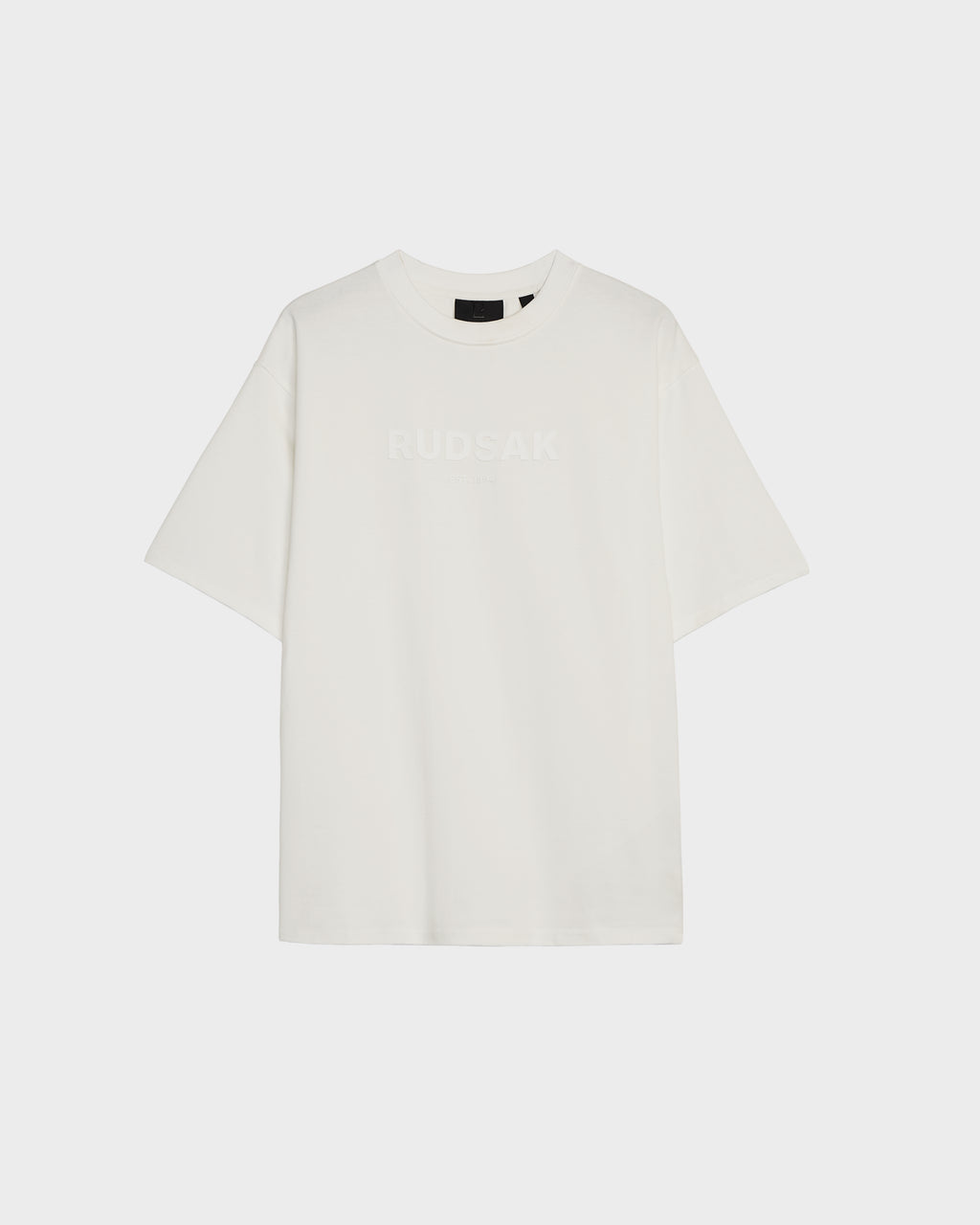 The KARTER - 9524008 Iceland W by Rudsak is an oversized unisex premium cotton T-shirt in plain white, featuring RUDSAK subtly printed across the chest, displayed against a light background.