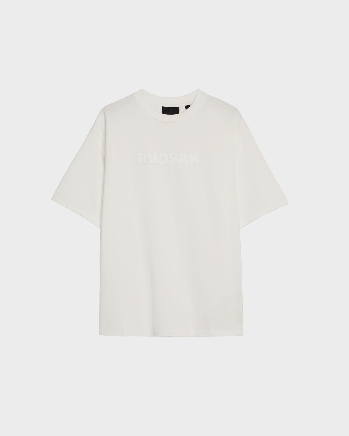 The KARTER - 9524008 Iceland W by Rudsak is an oversized unisex premium cotton T-shirt in plain white, featuring RUDSAK subtly printed across the chest, displayed against a light background.