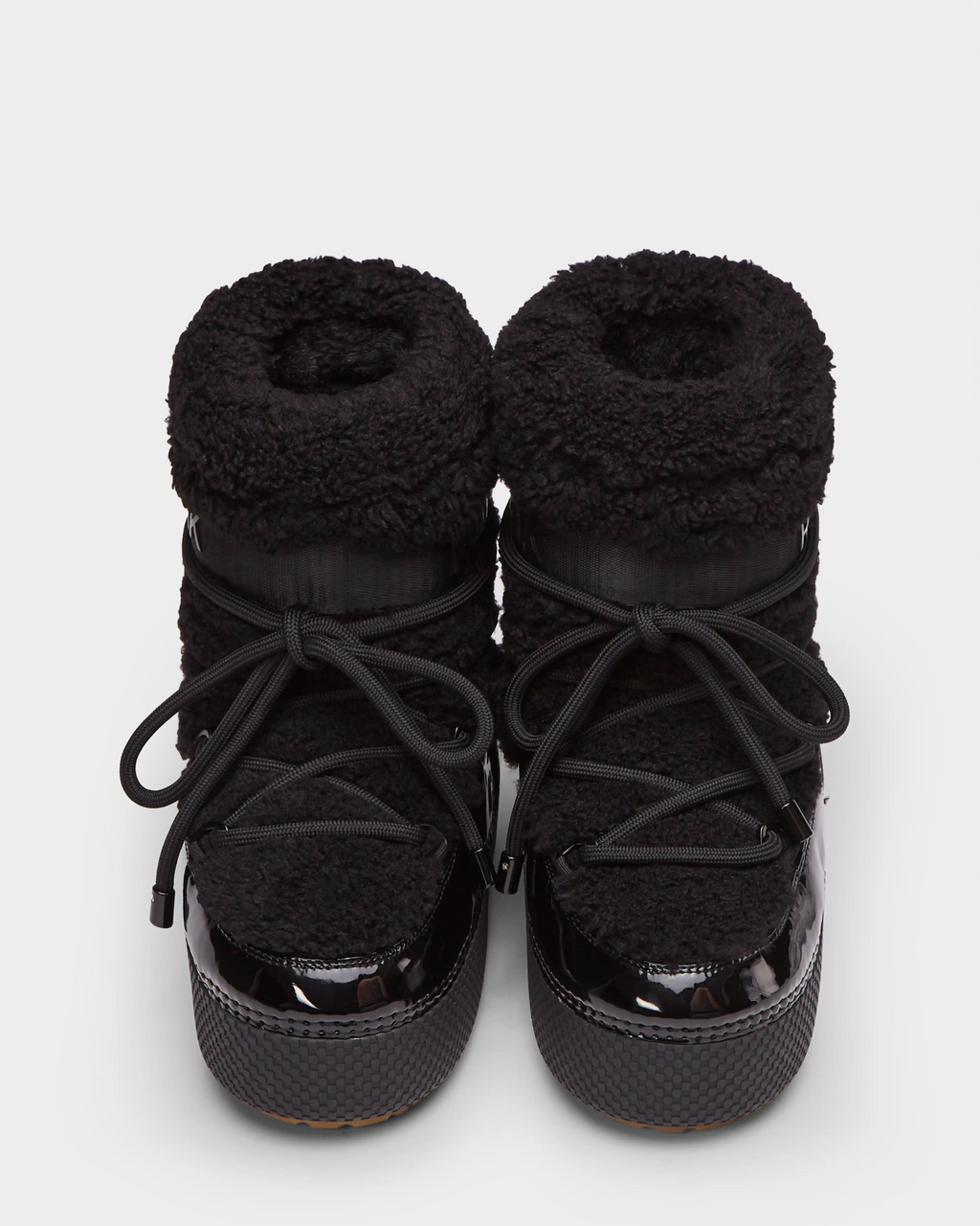 A pair of Rudsak KATHY - 8223513 Black women’s winter boots with fuzzy, textured uppers, glossy rubber toes, and thick laces, shown on a plain white background.