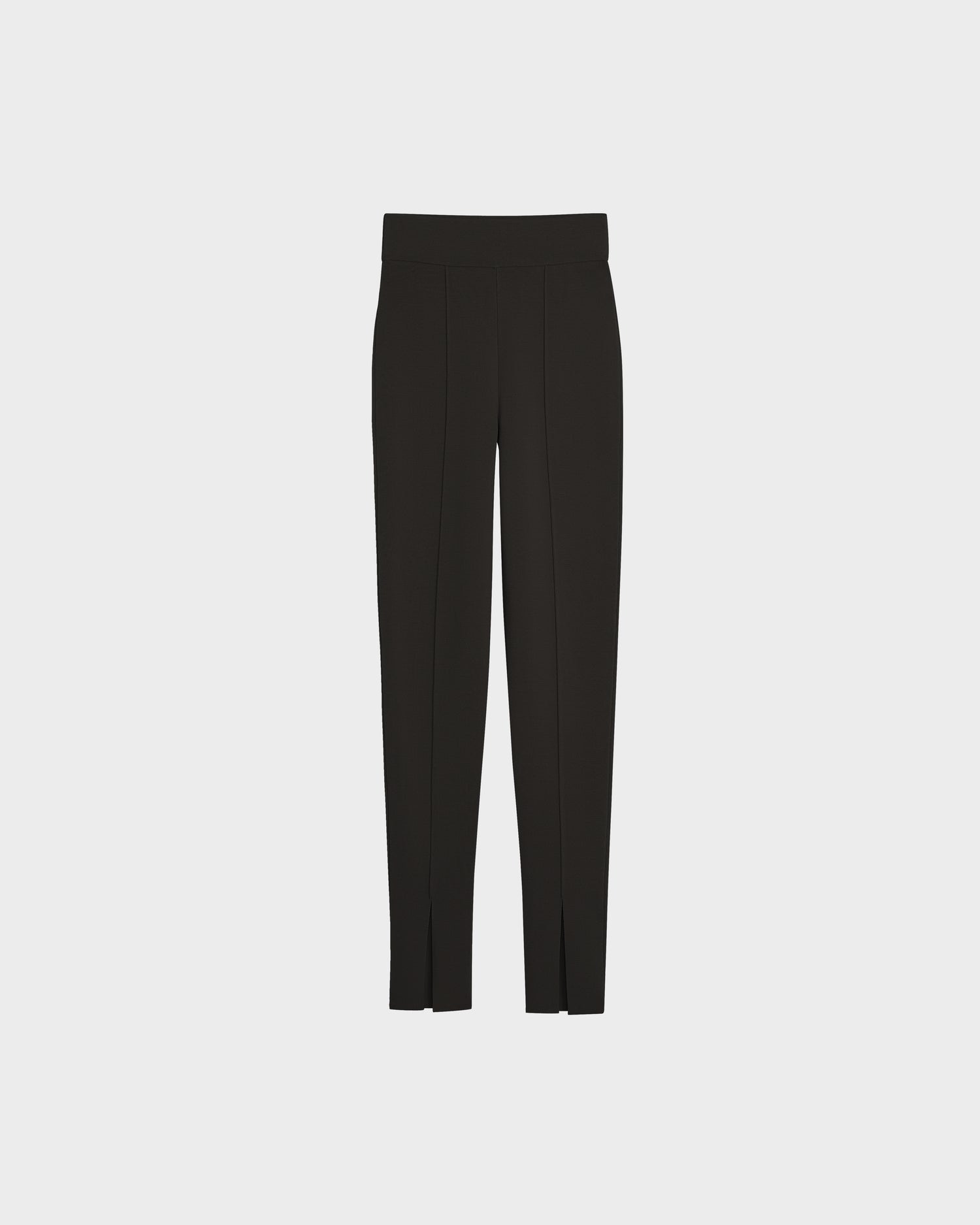 The MATHILDA - 8524515 Black womens knit leggings by Rudsak feature a fitted waistband, straight legs, and front seams, showcased against a plain light gray background.