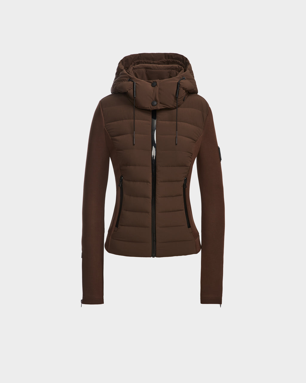 The Rudsak MABS - 8124825 Espresso is a brown, fitted women’s puffer jacket with a hood, front zipper, and zippered side pockets, shown on a white background. This lightweight short jacket offers warmth and modern style for everyday wear.