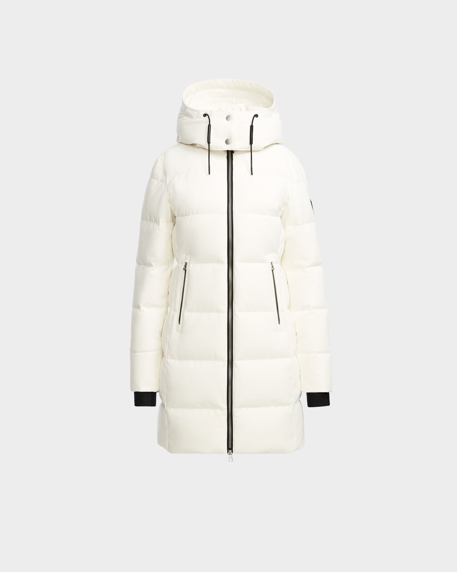 The Rudsak MIRIAM - L123544 Iceland is a white womens knee-length down puffer jacket with a hood, black front zipper, zippered side pockets, and black cuffs, shown on a plain light gray background.