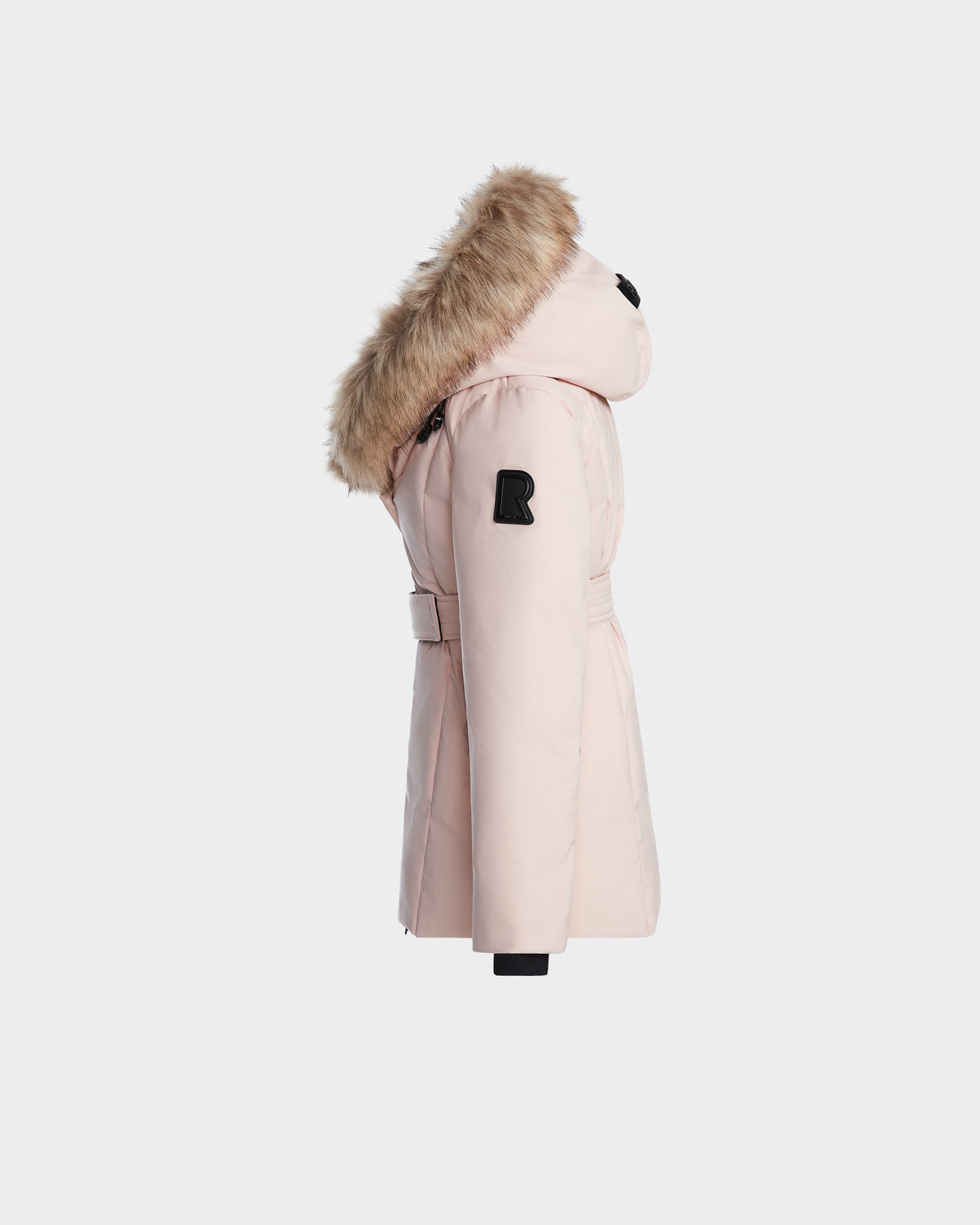 The MODA K - 0124505 Pastel Pink by Rudsak is a light pink recycled nylon winter coat with a fur-trimmed hood, belted waist, and a black R patch on the upper sleeve, shown from the side.