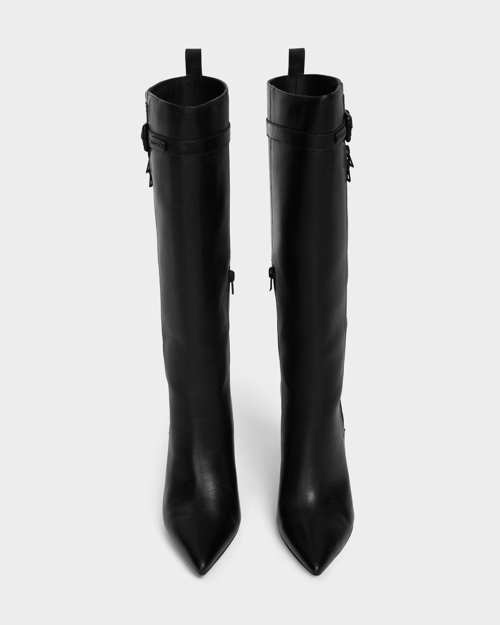 The Rudsak NANCY - 8224507 Black features tall, black high shaft boots with pointed toes and side buckles, displayed from above on a light gray background.