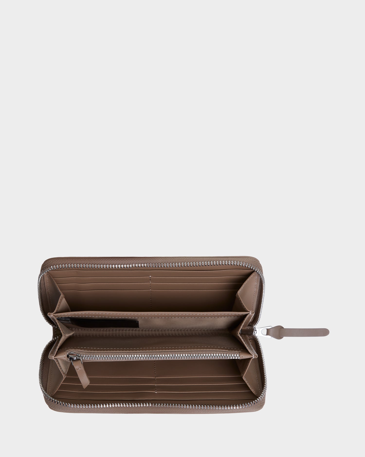 A top-down view of the Rudsak NYLA - L424502 Sand womens leather wallet, featuring multiple card slots and a central zippered coin pocket, displayed against a plain white background.