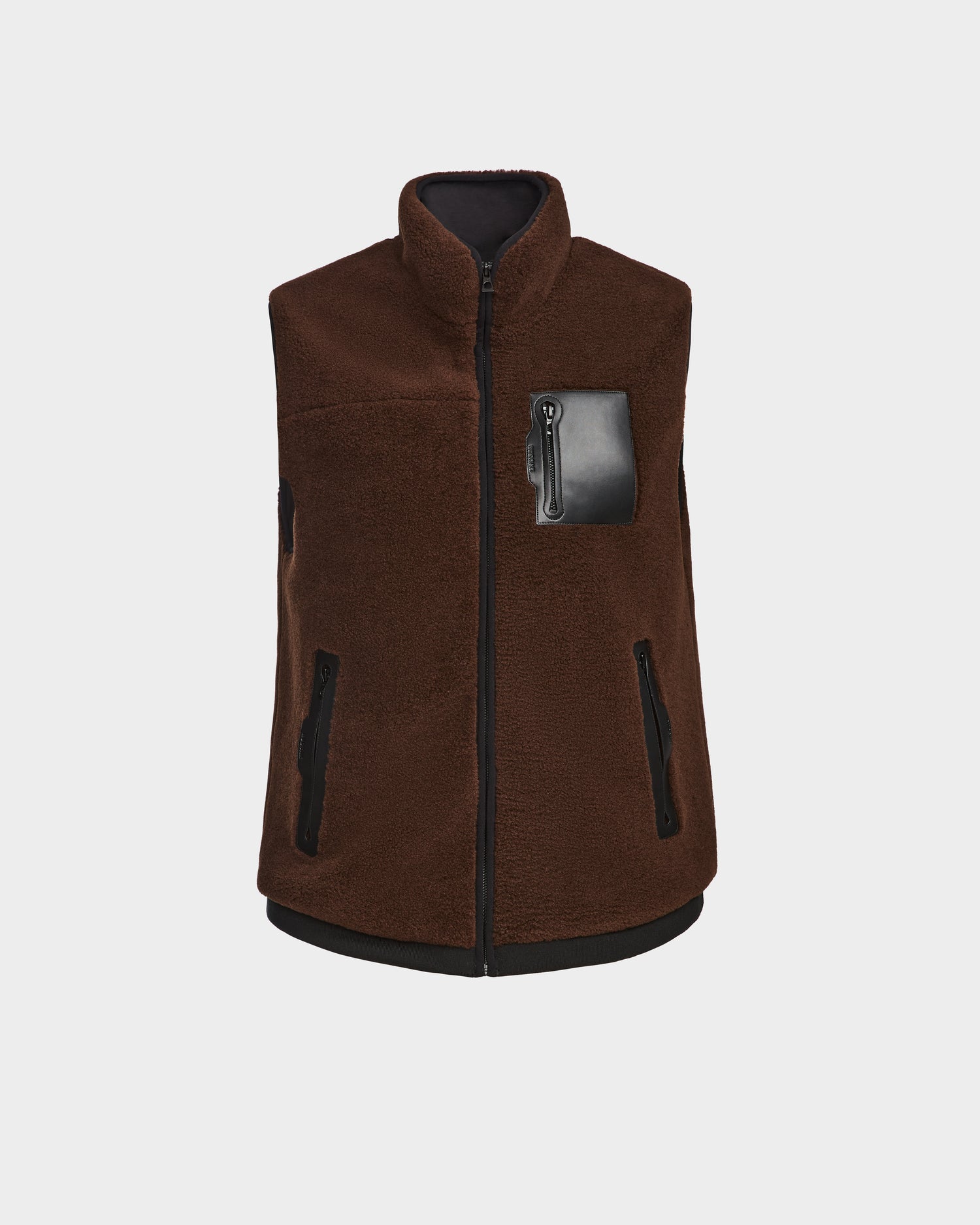 The Rudsak RUMMY - U524502 Espresso W is a sleeveless brown polar fleece zip-up vest with black zipper closure, black trim on pockets and hem, two zippered side pockets, and a leather-accented chest pocket, shown on a plain white background.