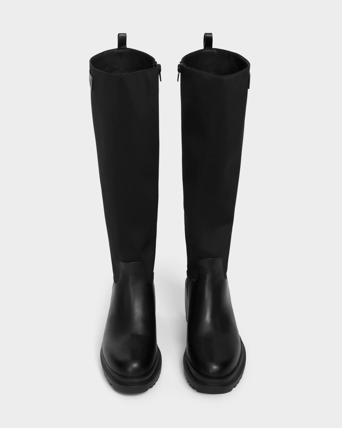 The Rudsak TIARA - 8224529 Black boots feature a tall, block high-shaft design with rounded toes and chunky soles, photographed from above on a plain white background.