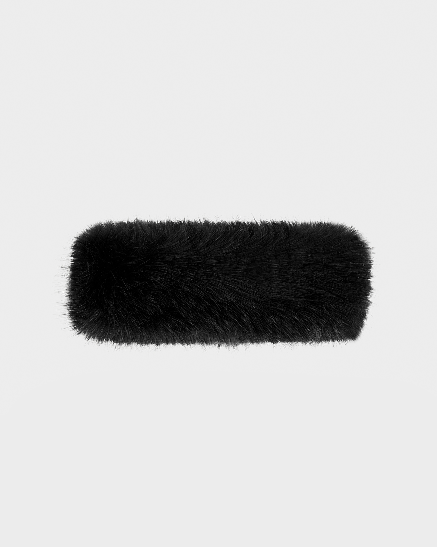 The ARLETTE - 8425544 Black by Rudsak is a rectangular women’s faux fur headband, shown on a plain light gray background—a stylish winter accessory for chic cold-weather looks.