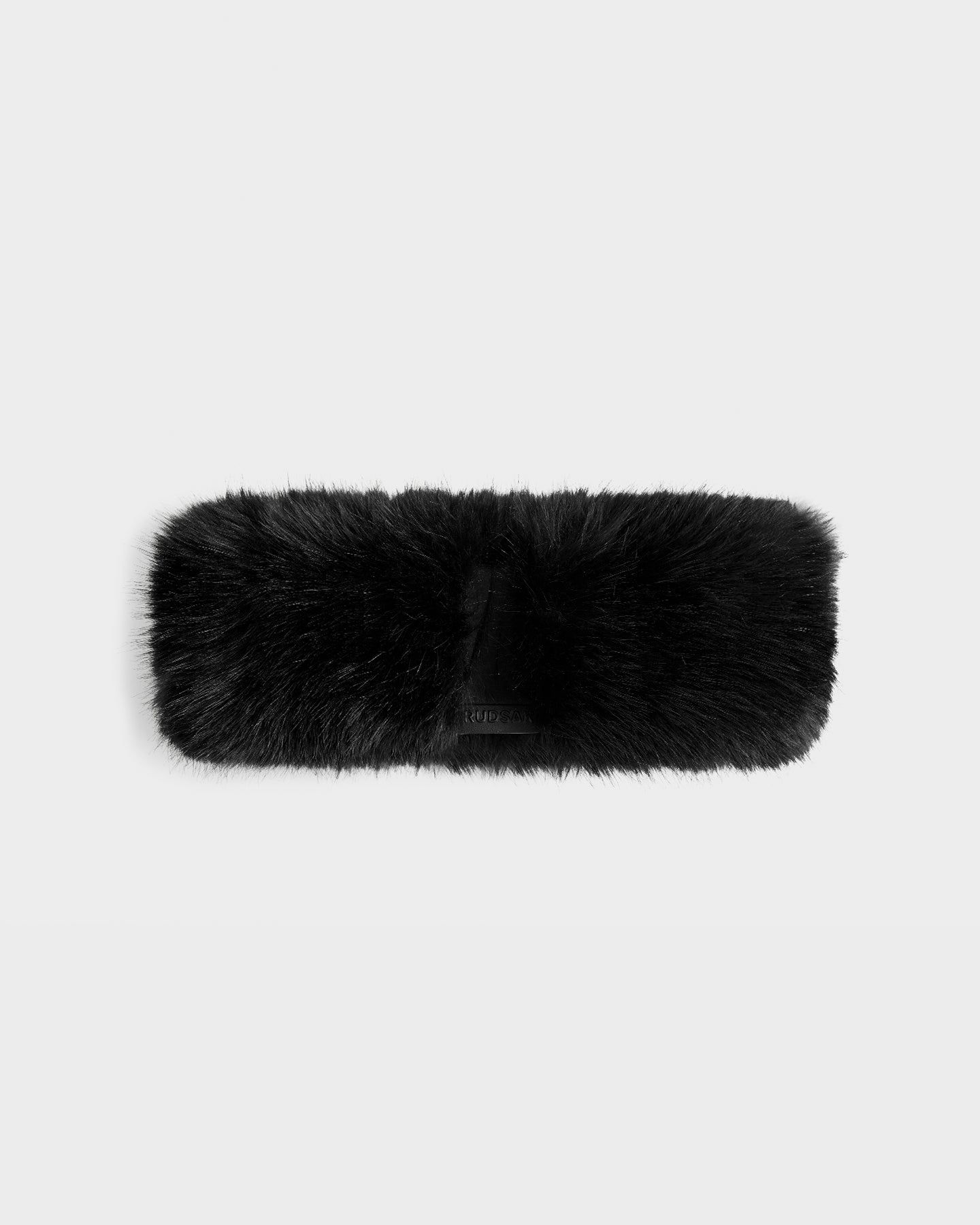 The Rudsak ARLETTE - 8425544 Black women’s faux fur headband features a soft, fluffy texture, making it a chic winter accessory. Displayed on a plain light gray background.