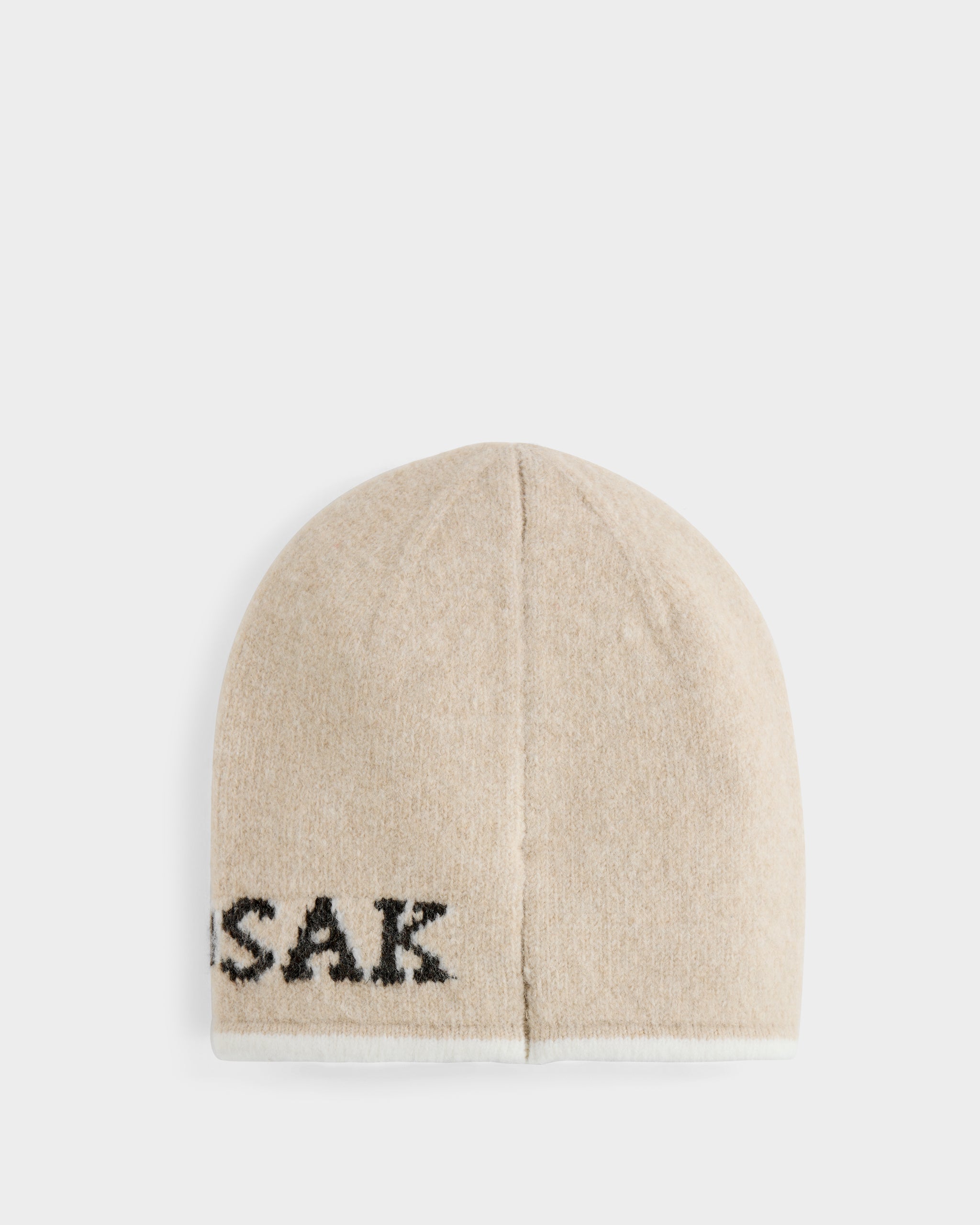 The Rudsak AXEL - 6425040 Vanilla is a textured knit beige men’s beanie with partially visible black SAK text near the edge, shown on a white background—a stylish winter accessory.