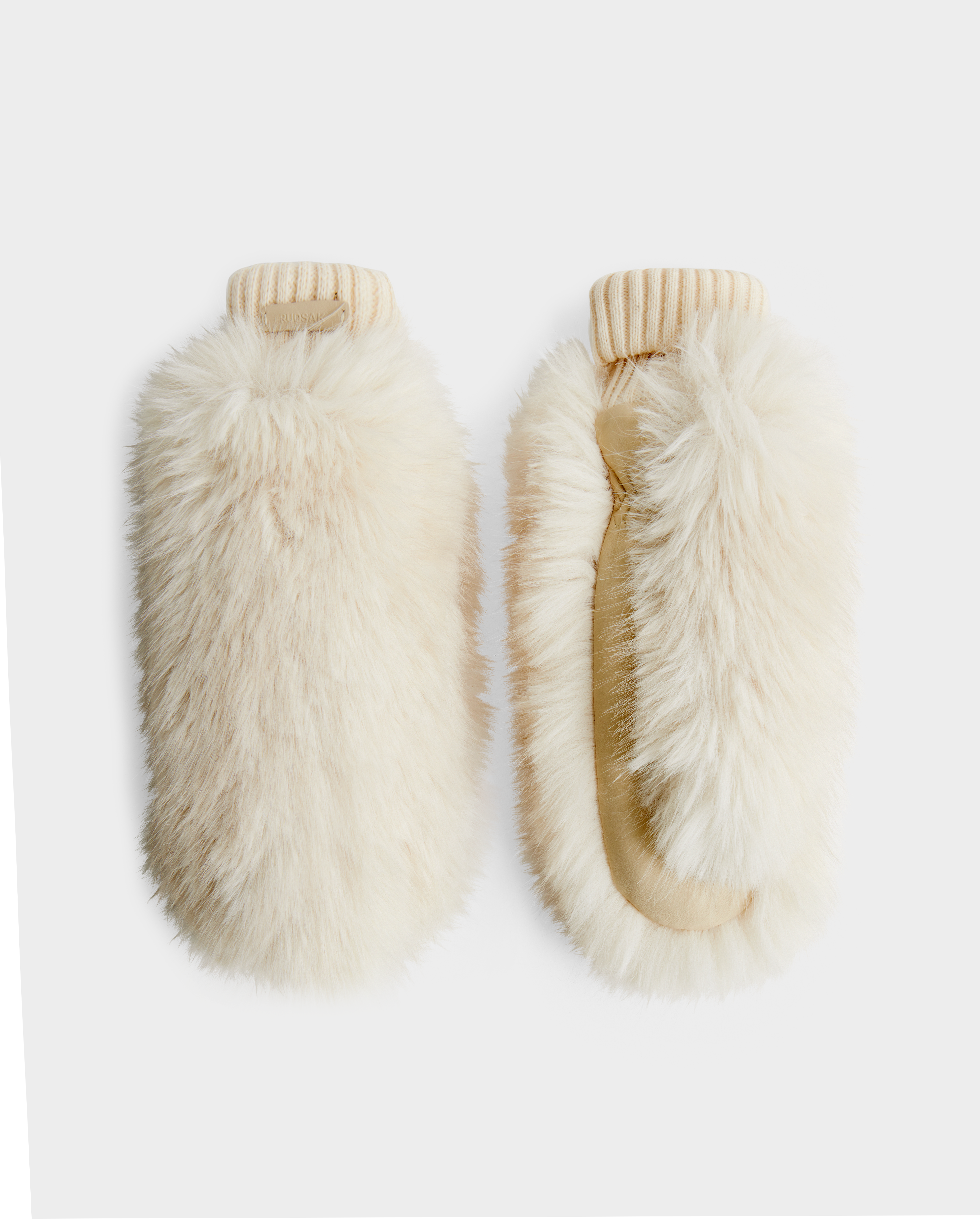 A pair of BELLA - 8425006 Vanilla mittens by Rudsak, featuring fluffy cream-colored faux fur and ribbed knit cuffs, displayed side by side on a plain white background.