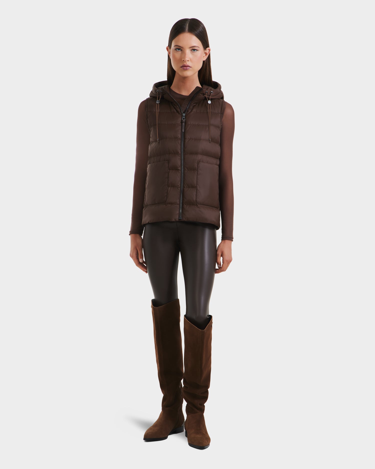 A woman showcases the Rudsak BETHANY - 8125625 Mocha modular outerwear, pairing it with stylish layers and boots for a chic, versatile look.