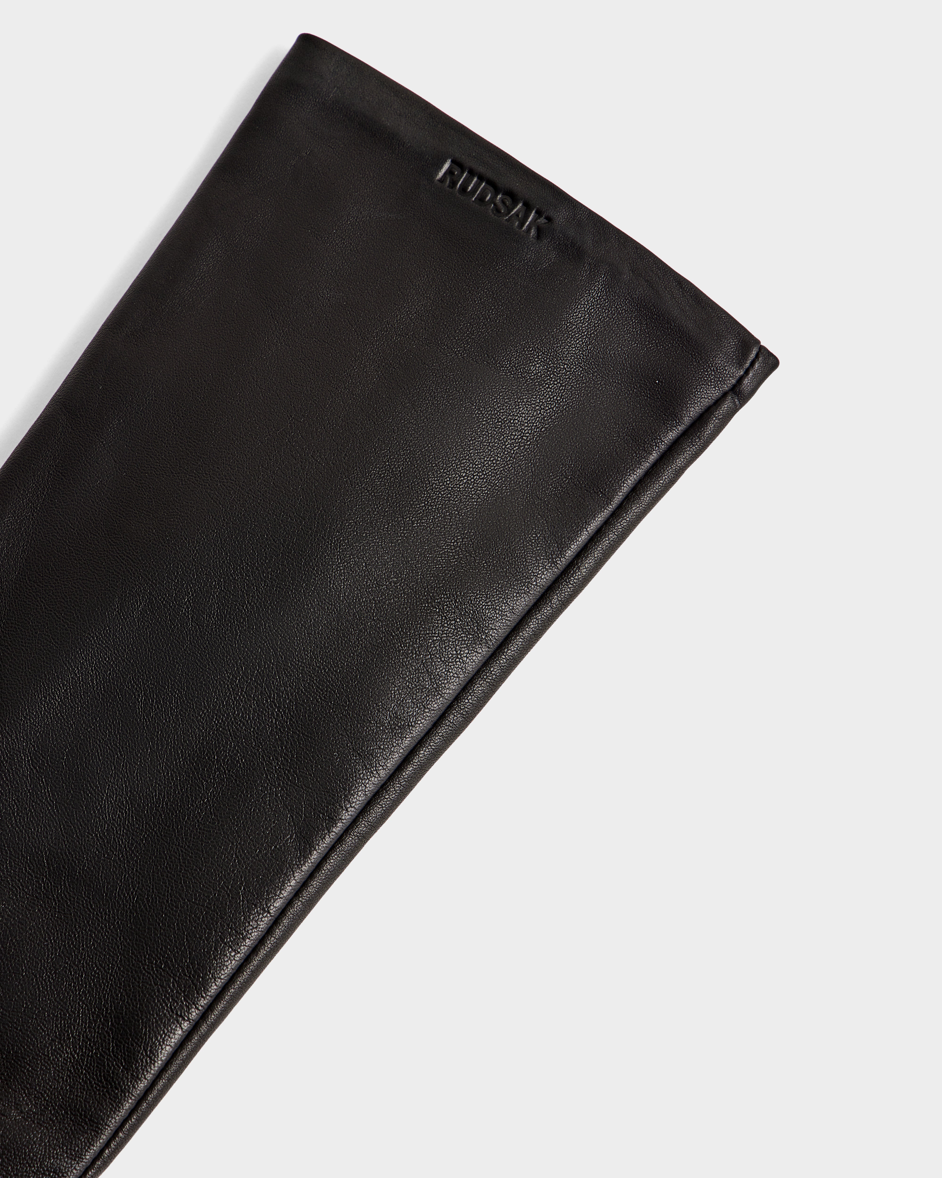 A close-up of the BLAKE - 8425542 Black women's leather glove by Rudsak, featuring the brand’s name embossed near the top edge, set against a plain white background.
