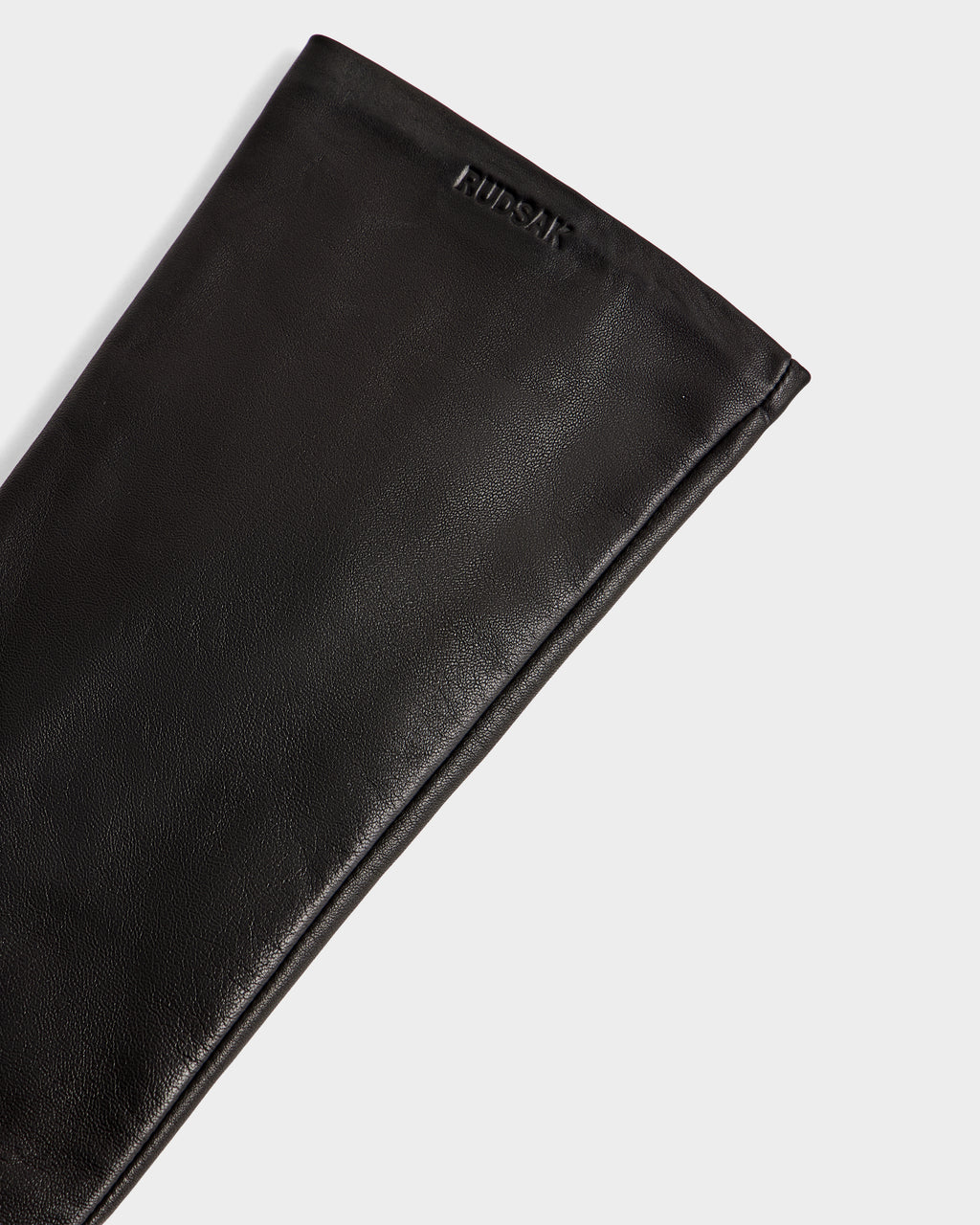 A close-up of the BLAKE - 8425542 Black women's leather glove by Rudsak, featuring the brand’s name embossed near the top edge, set against a plain white background.