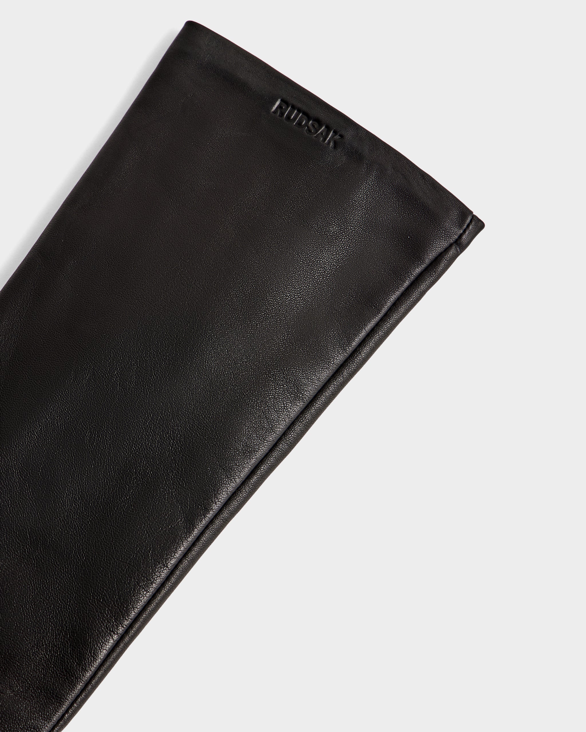 A close-up of the BLAKE - 8425542 Black women's leather glove by Rudsak, featuring the brand’s name embossed near the top edge, set against a plain white background.