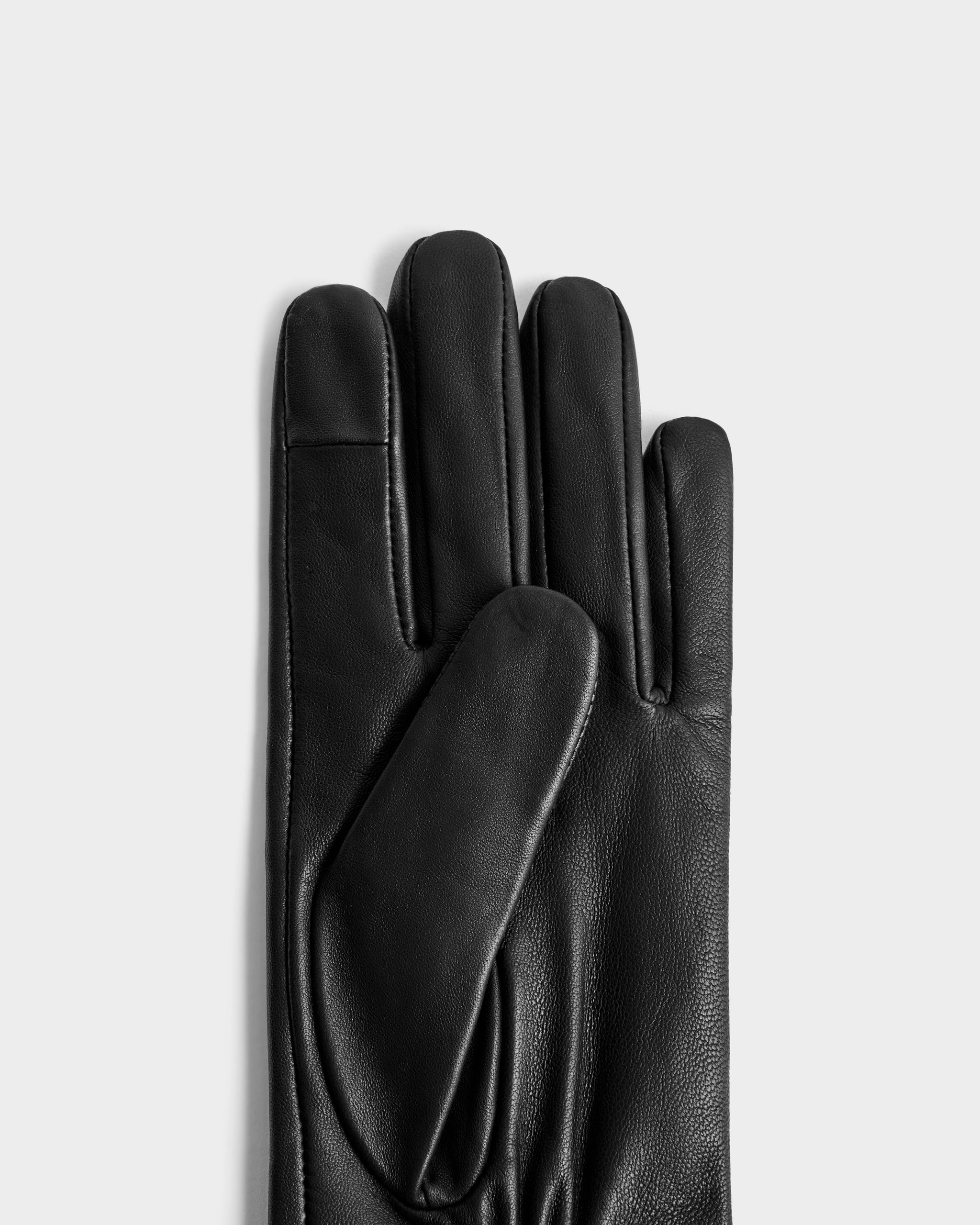 The Rudsak BLAKE - 8425542 Black women's leather glove is displayed palm-up with fingers extended, set against a plain light gray background.