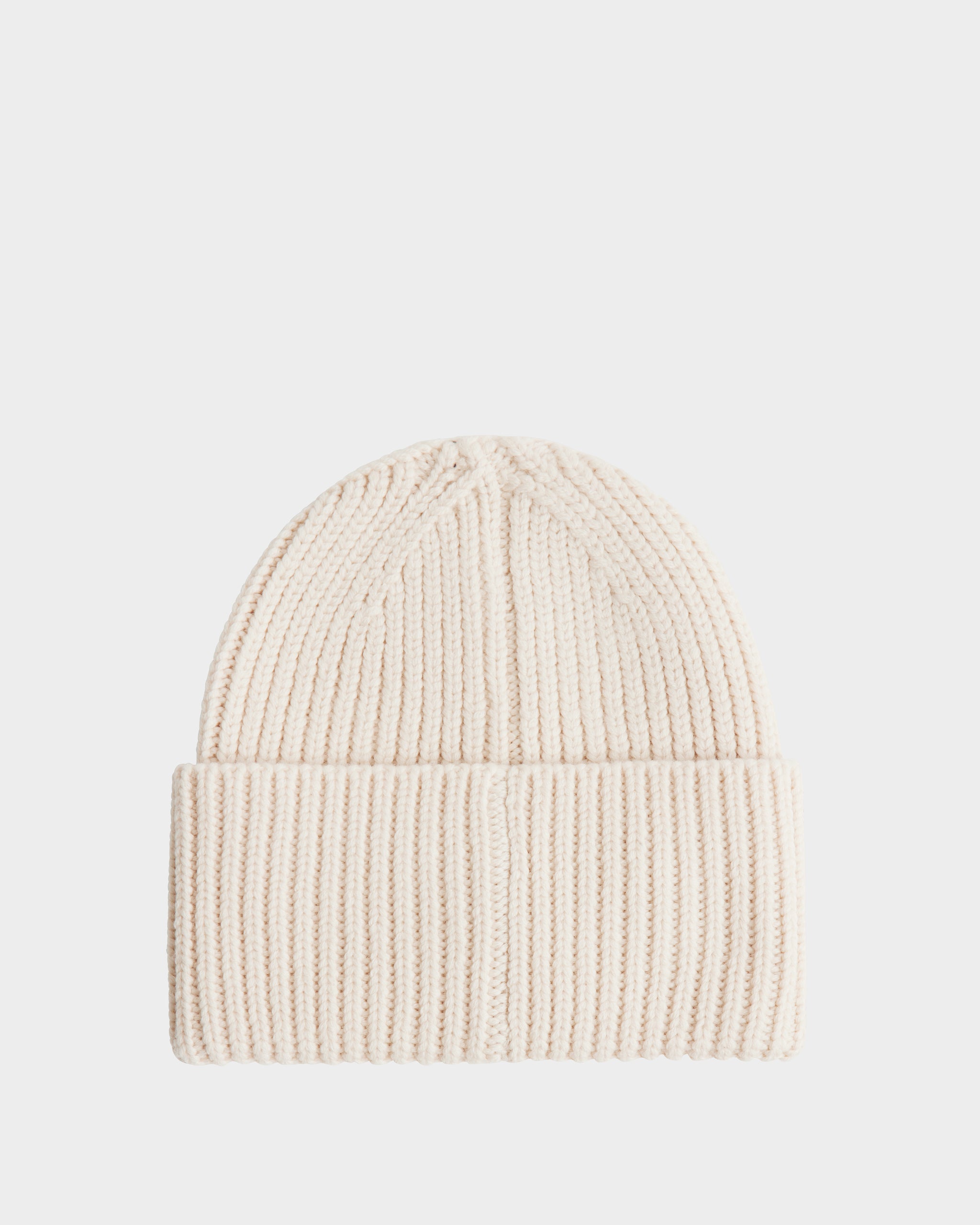 The Rudsak COLIN - 9424518 Vanilla is a cream-colored unisex ribbed knit beanie with a folded brim, shown on a plain white background.