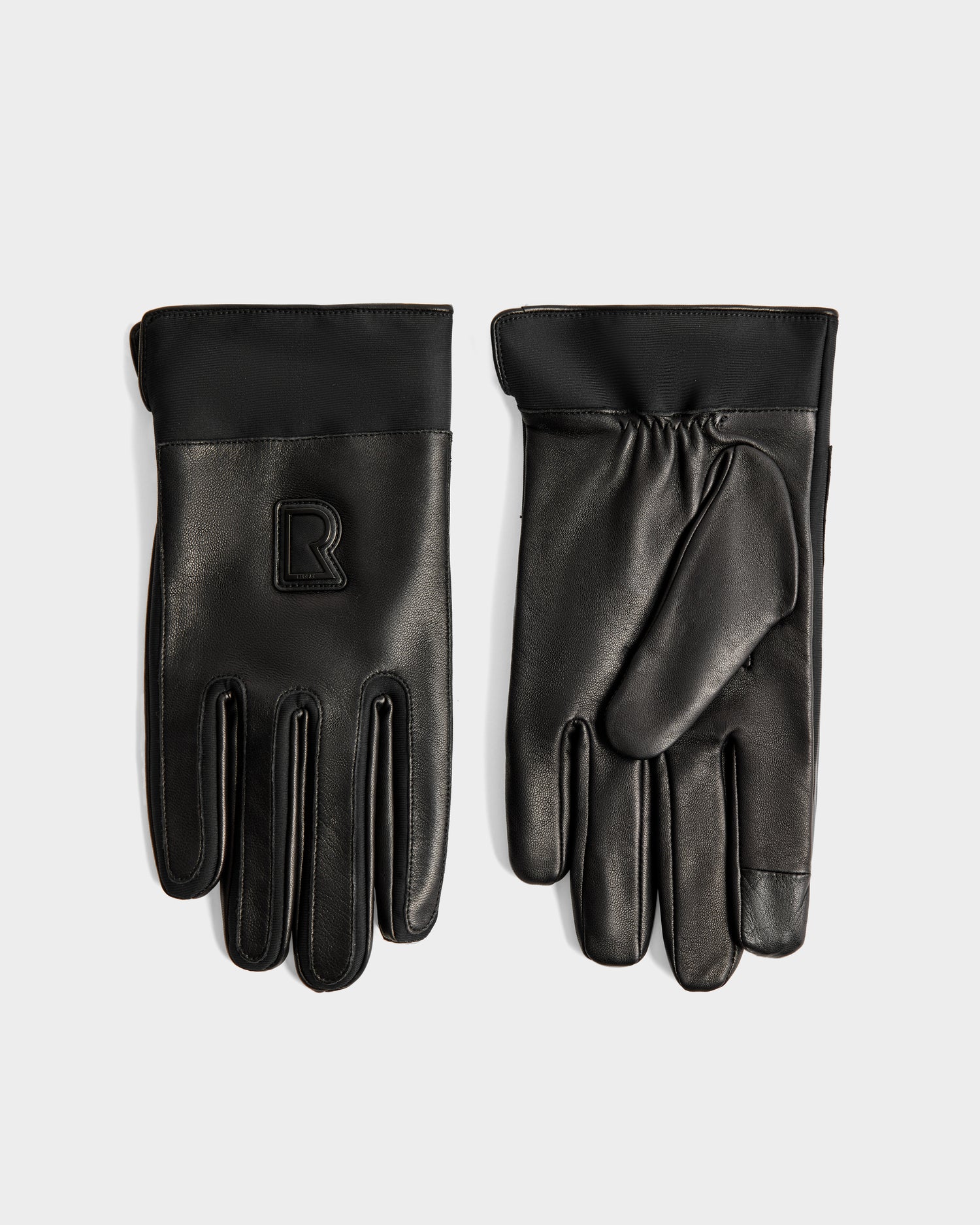 The EDDIE - 6425037 Black men's leather gloves by Rudsak feature a raised R logo on the back of one glove and are shown flat on a light background.