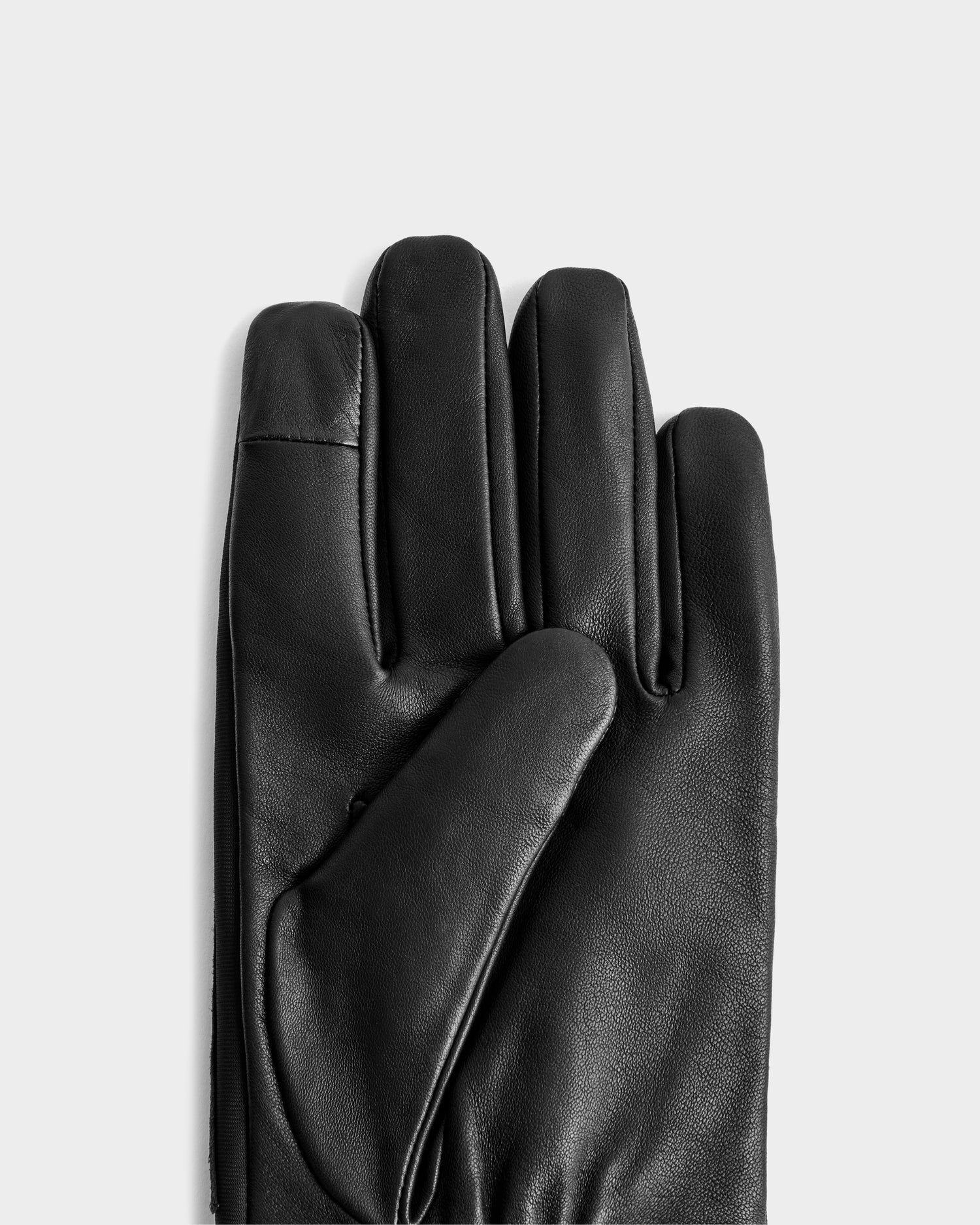 The EDDIE - 6425037 Black men’s leather glove by Rudsak is displayed palm up on a light gray background, highlighting its smooth finish, thumb, and three fingers.