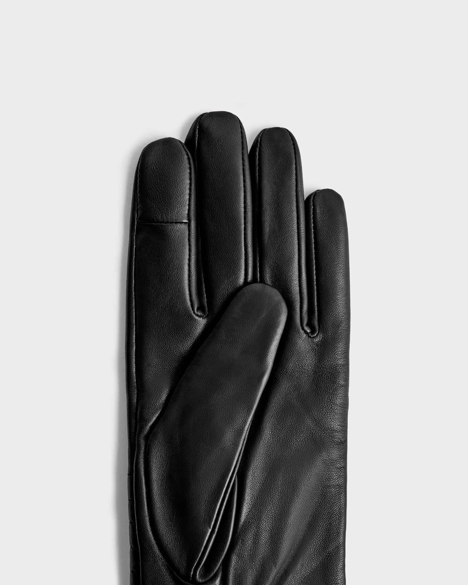 The GEMMA - 8425008 Black glove by Rudsak, a classic winter accessory, is shown palm side up on the left against a plain light gray background.