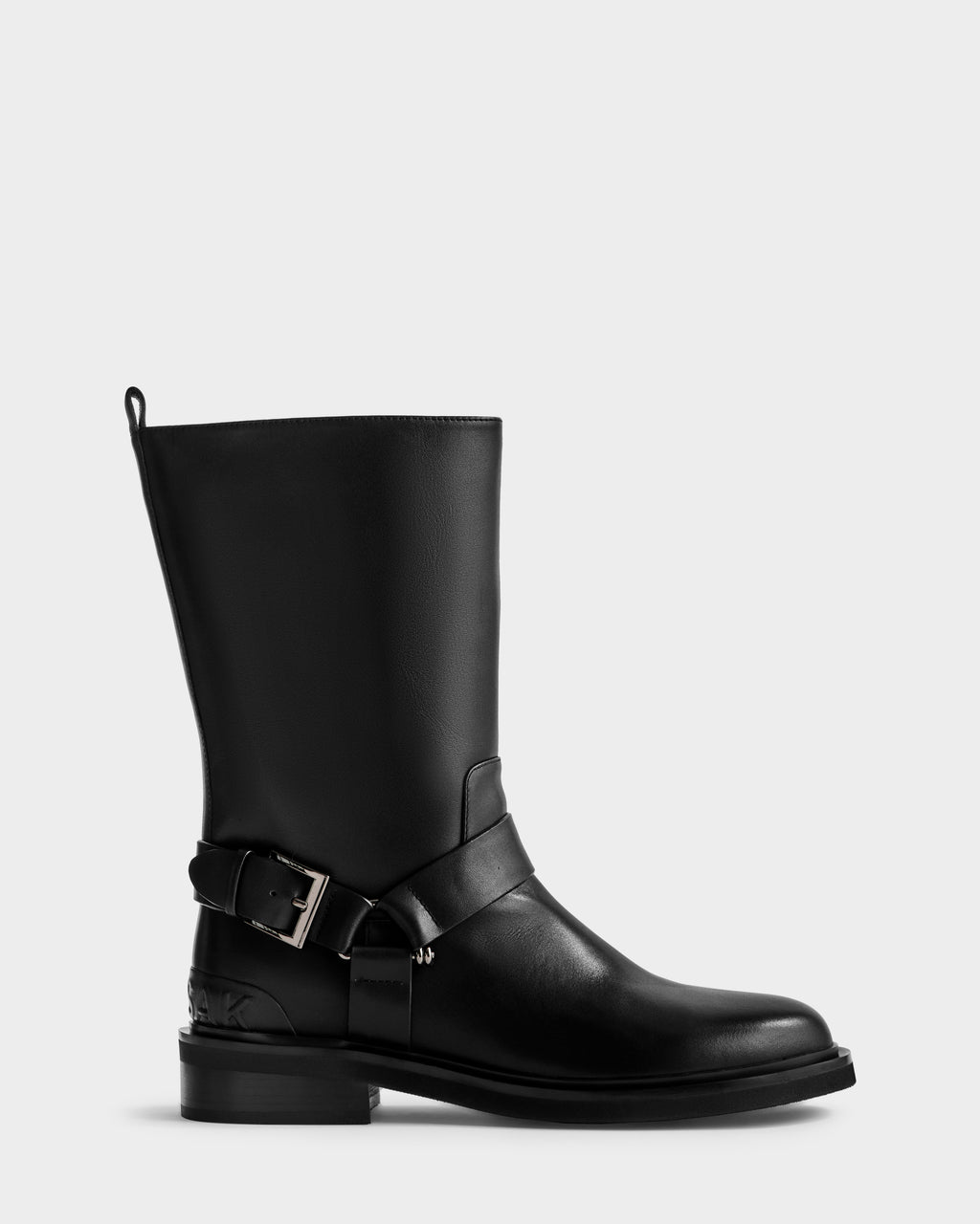The Rudsak KIRRA - 8225558 Black is a women's black leather mid-calf moto boot with a rounded toe, silver buckle strap detail, low block heel, and back pull tab—versatile and stylish for any look.