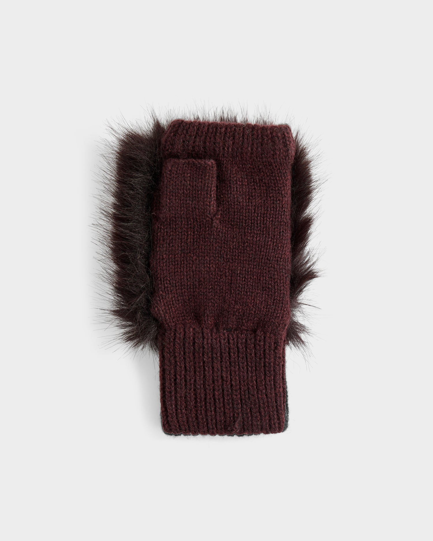 The Rudsak LIA - 8425007 Bordeaux is a women’s fingerless mitten in burgundy wool-blend with ribbed cuff and black faux fur trim along the edges, shown on a plain light gray background.