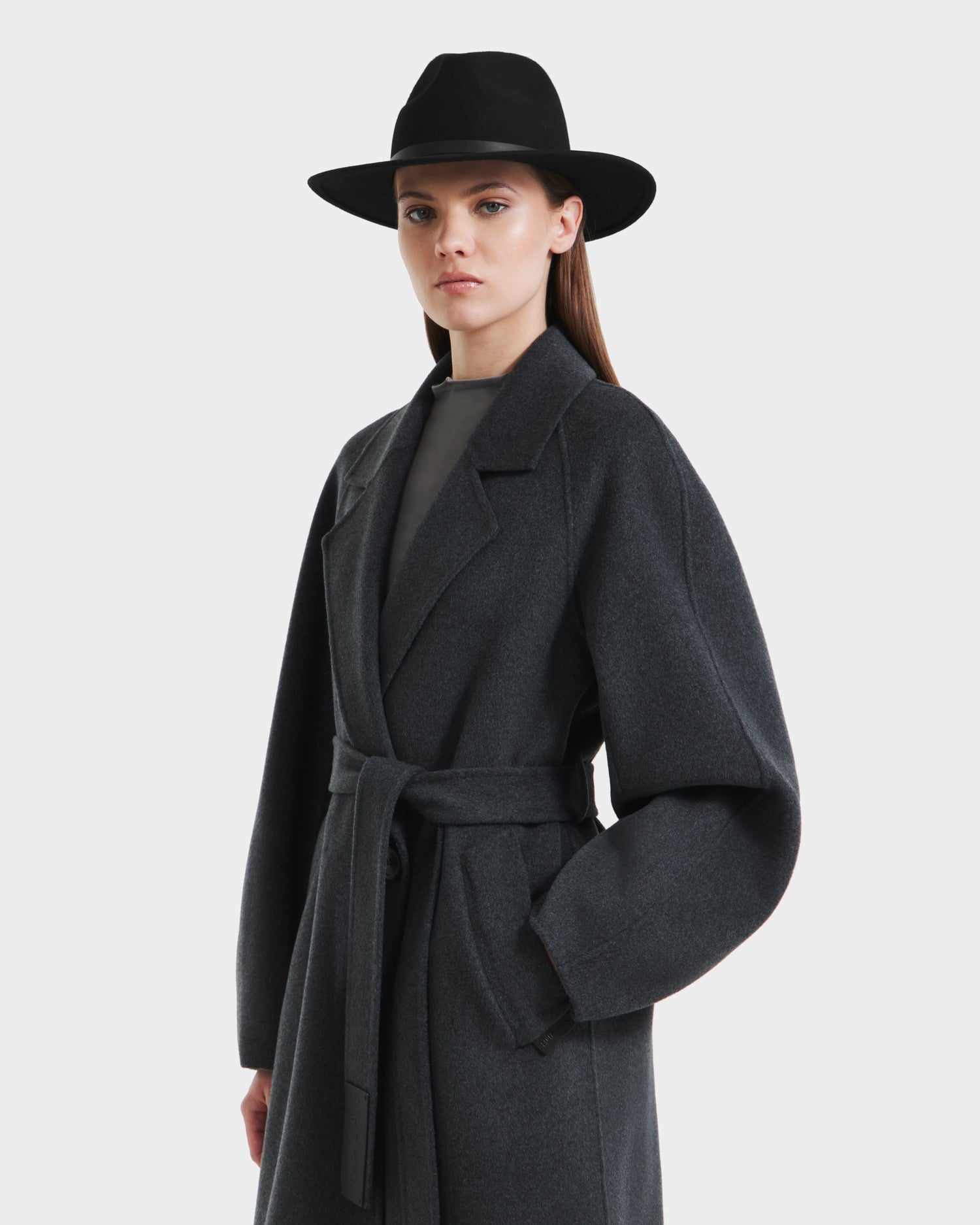 A woman wearing a heather charcoal LILIA - 8125634 coat by Rudsak stands against a plain white background, looking confidently at the camera.
