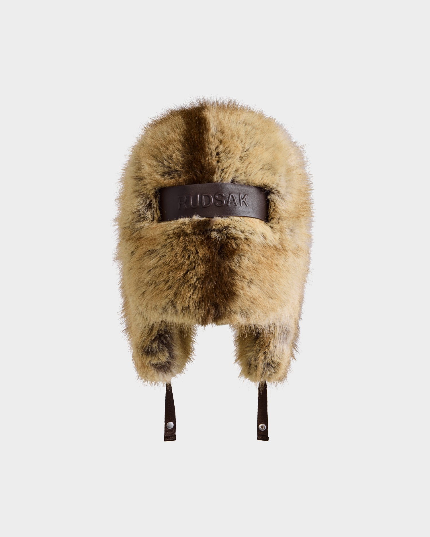 The LIRA - 8425024 Mix Mocha by Rudsak is a brown and beige women’s faux fur aviator hat with ear flaps, dual chin straps, and a leather Rudsak band, offering cozy winter warmth and après-ski style, shown on a plain white background.