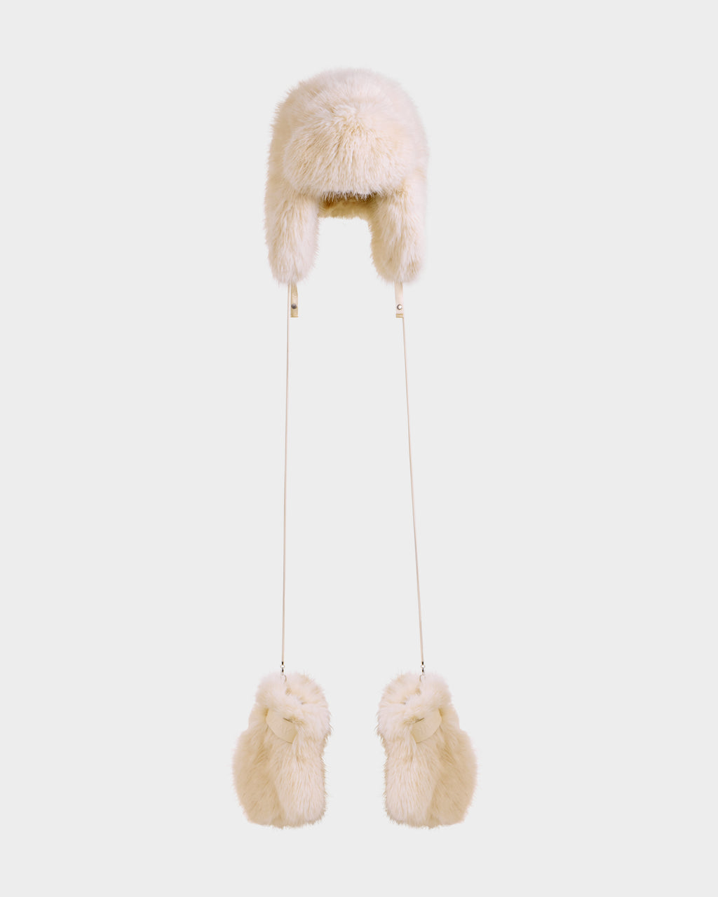 The Rudsak LIRA - 8425024 Vanilla is a women’s beige faux fur aviator hat with ear flaps, long strings, and matching pom-poms—ideal for après-ski style and winter warmth, shown on a plain white background.