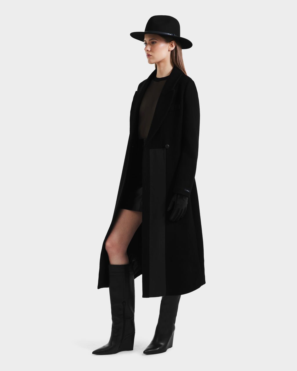A woman wears the Rudsak LYNWOOD - 8125539 Black premium wool coat and hat.