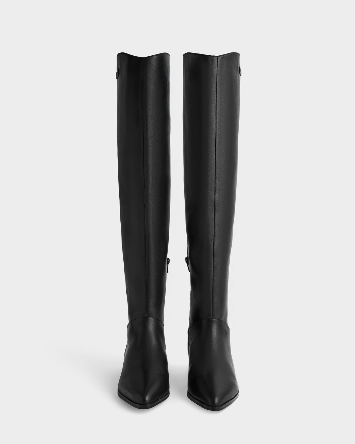 The Rudsak MARSALLA - 8225033 Black boots are knee-high, sleek, and minimal with pointed toes, shown against a plain white background.