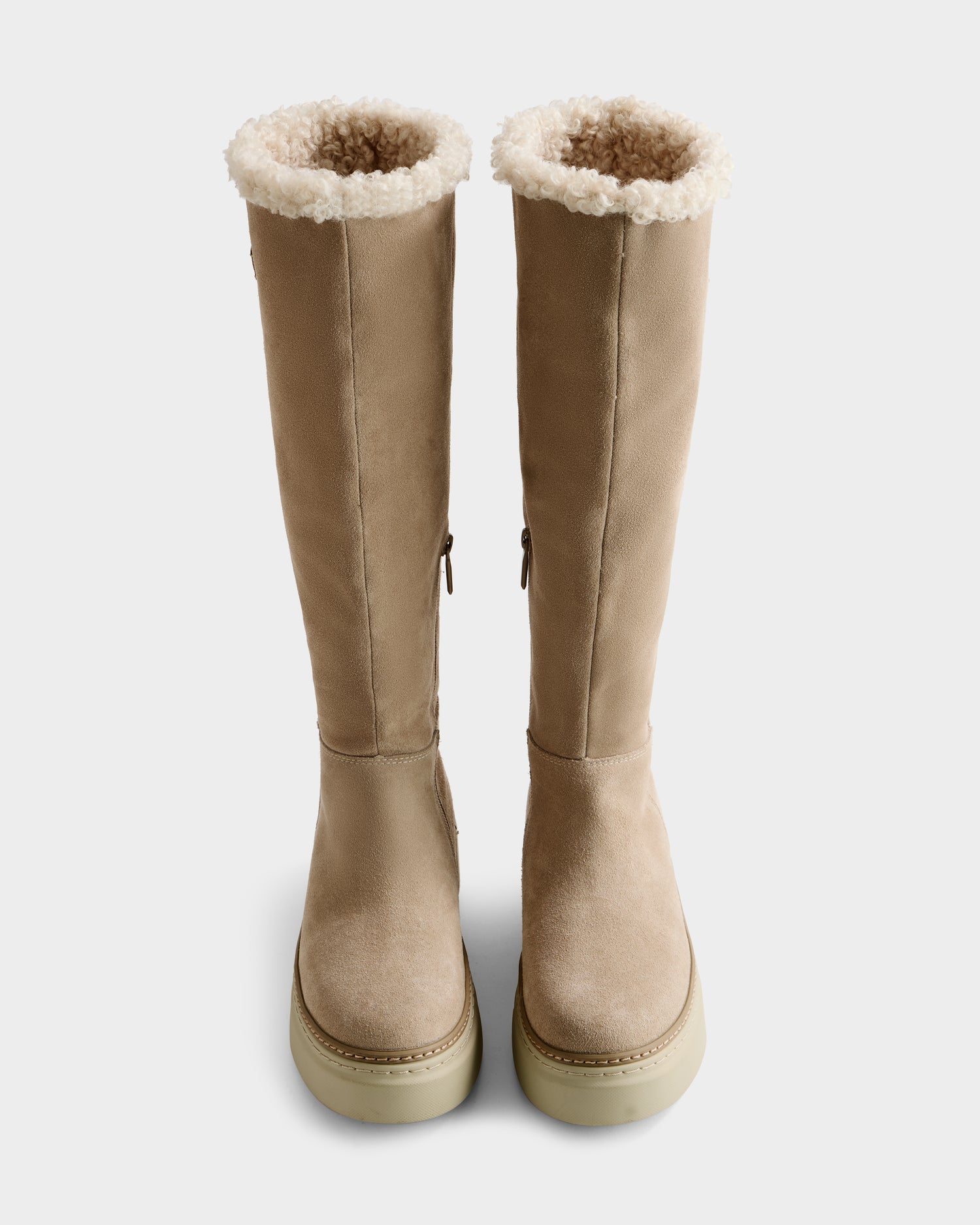 A pair of Rudsak MIKIE - 8225579 Almond tall beige suede boots with cream shearling lining, displayed from above on a white background.