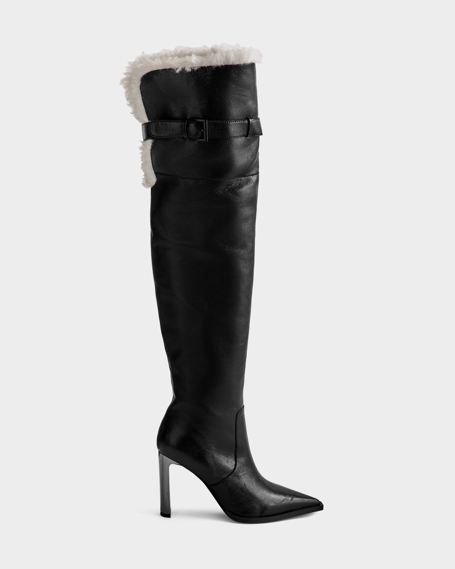 The Rudsak PERNA - 8225555 Black boot features black leather, a pointed toe, stiletto heel, buckle strap, and visible white shearling lining—ideal as a standout winter knee-high.