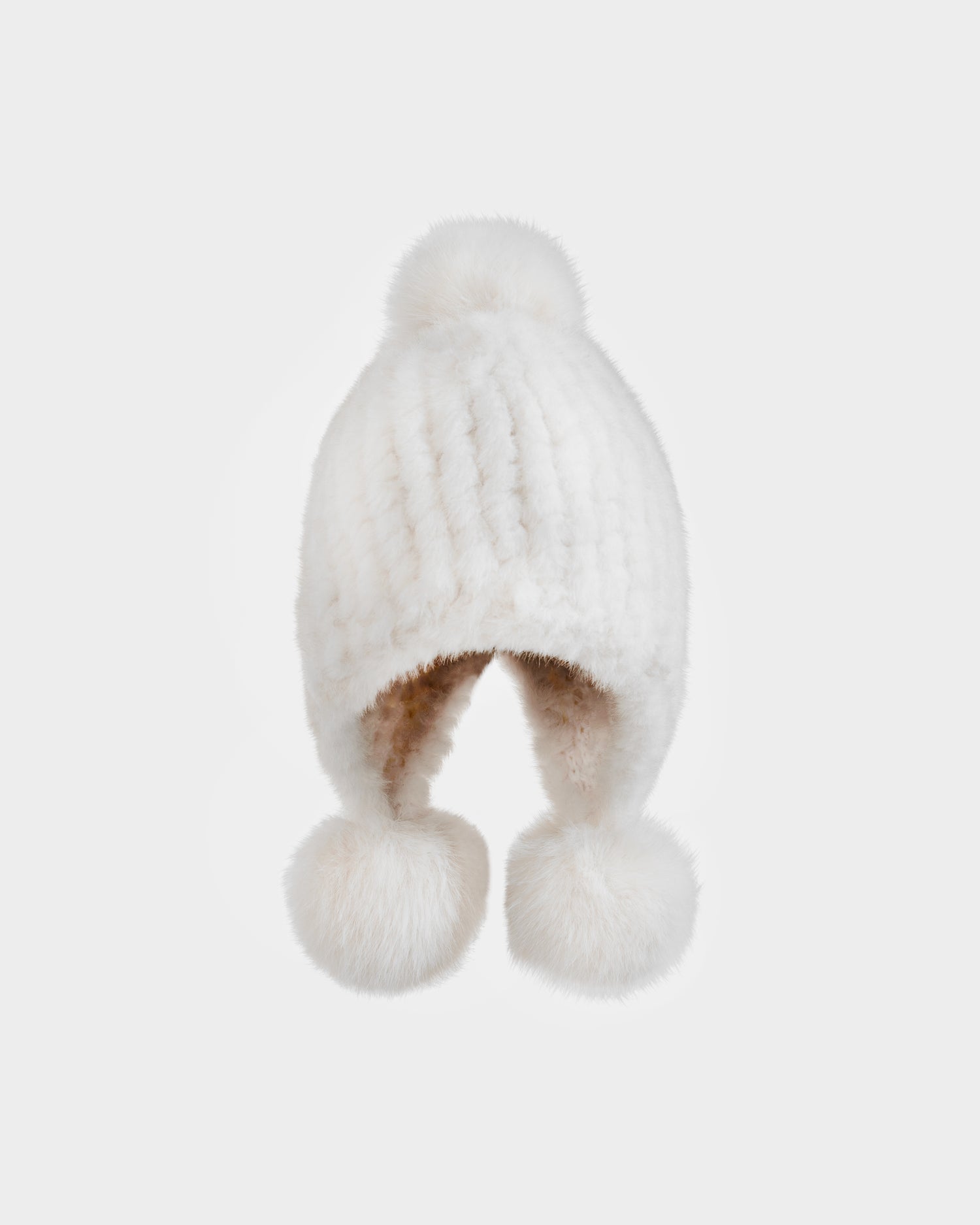 The Rudsak PIA - 8425547 Iceland is a women’s white faux fur hat featuring a fluffy pom-pom on top and two matching pom-poms hanging from its ear flaps, shown on a plain white background.