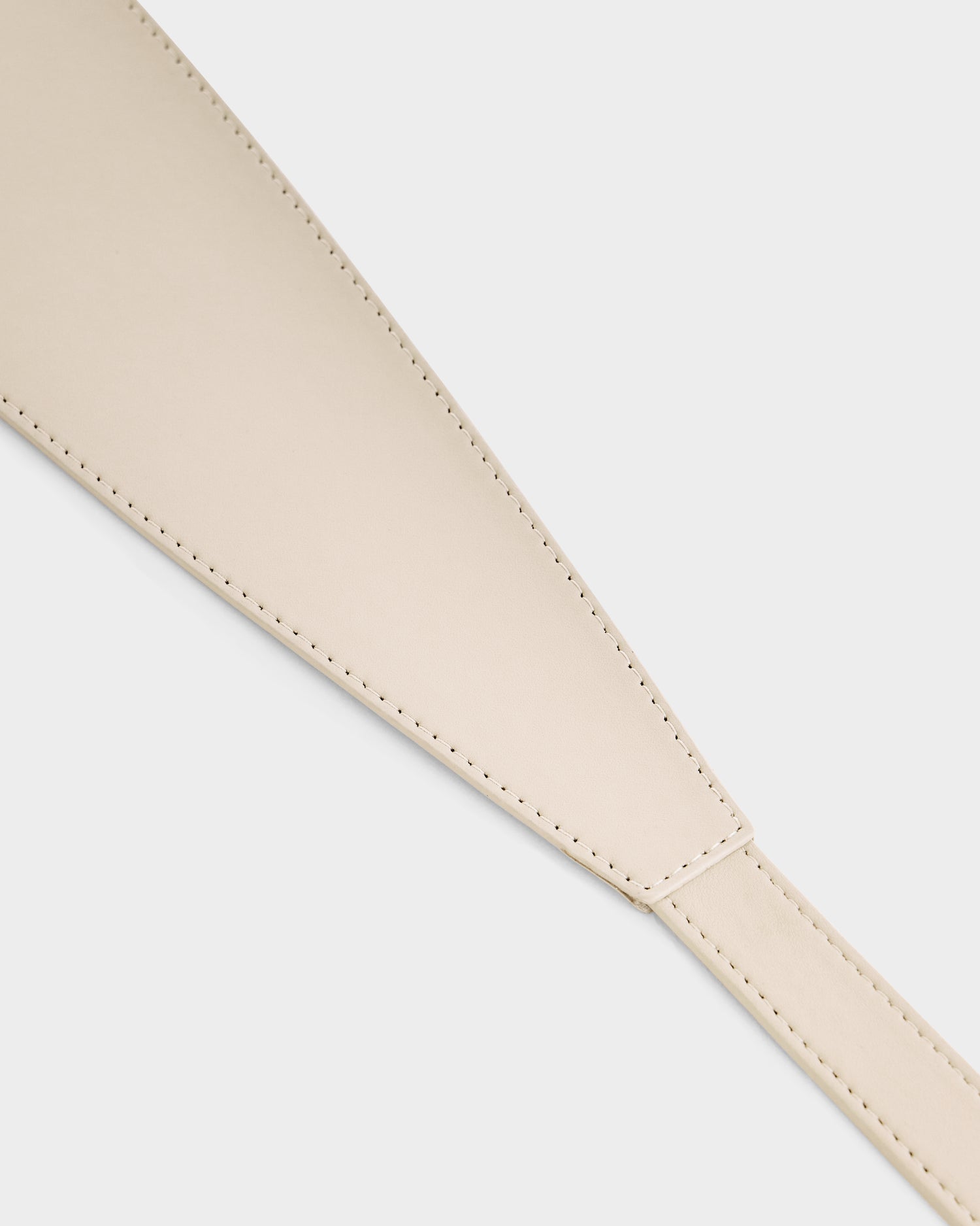 Close-up of the Rudsak RENA - 8425039 Vanilla beige leather strap, showing visible stitching along the edges, displayed on a plain white background.