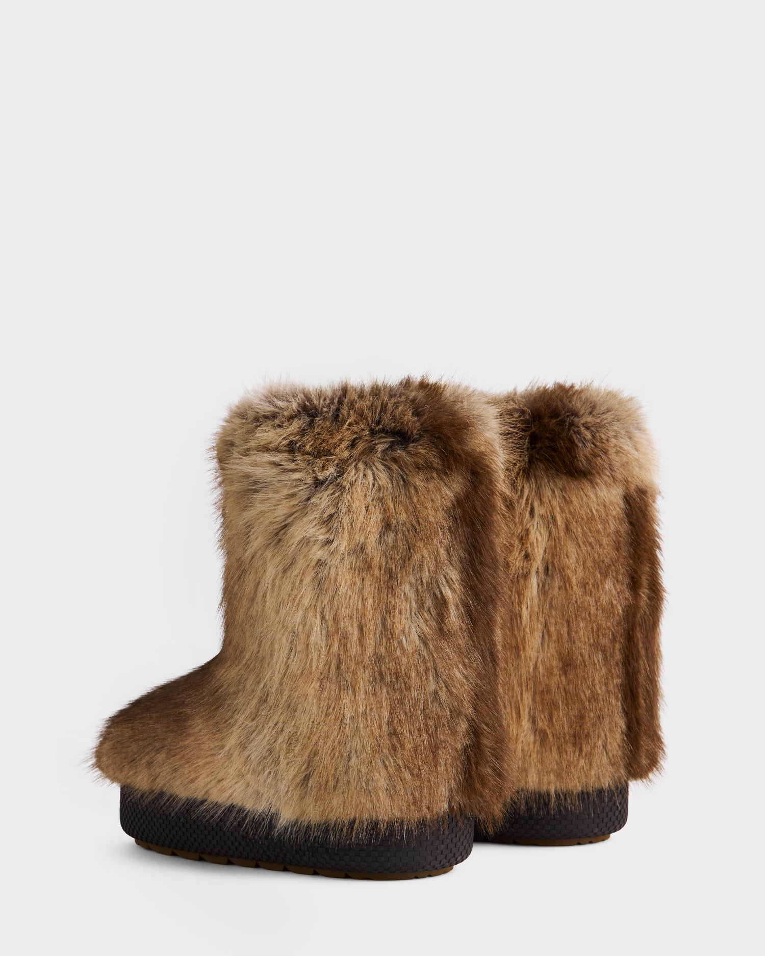 A pair of Rudsak SUZIE - 8225052 Mix Mocha women’s moon boots in brown with thick faux fur, shown from the back and side on a light background—ideal for cozy winter style.